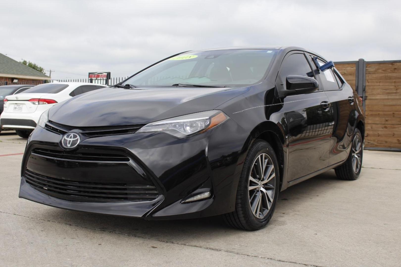 2018 Black Toyota Corolla LE CVT (5YFBURHE2JP) with an 1.8L L4 DOHC 16V engine, Continuously Variable Transmission transmission, located at 2401 E Main St., Grand Prairie, TX, 75050, (972) 262-4440, 32.748981, -96.969643 - Photo#1