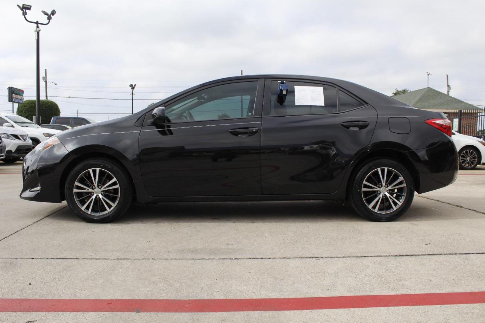 2018 Black Toyota Corolla LE CVT (5YFBURHE2JP) with an 1.8L L4 DOHC 16V engine, Continuously Variable Transmission transmission, located at 2401 E Main St., Grand Prairie, TX, 75050, (972) 262-4440, 32.748981, -96.969643 - Photo#2