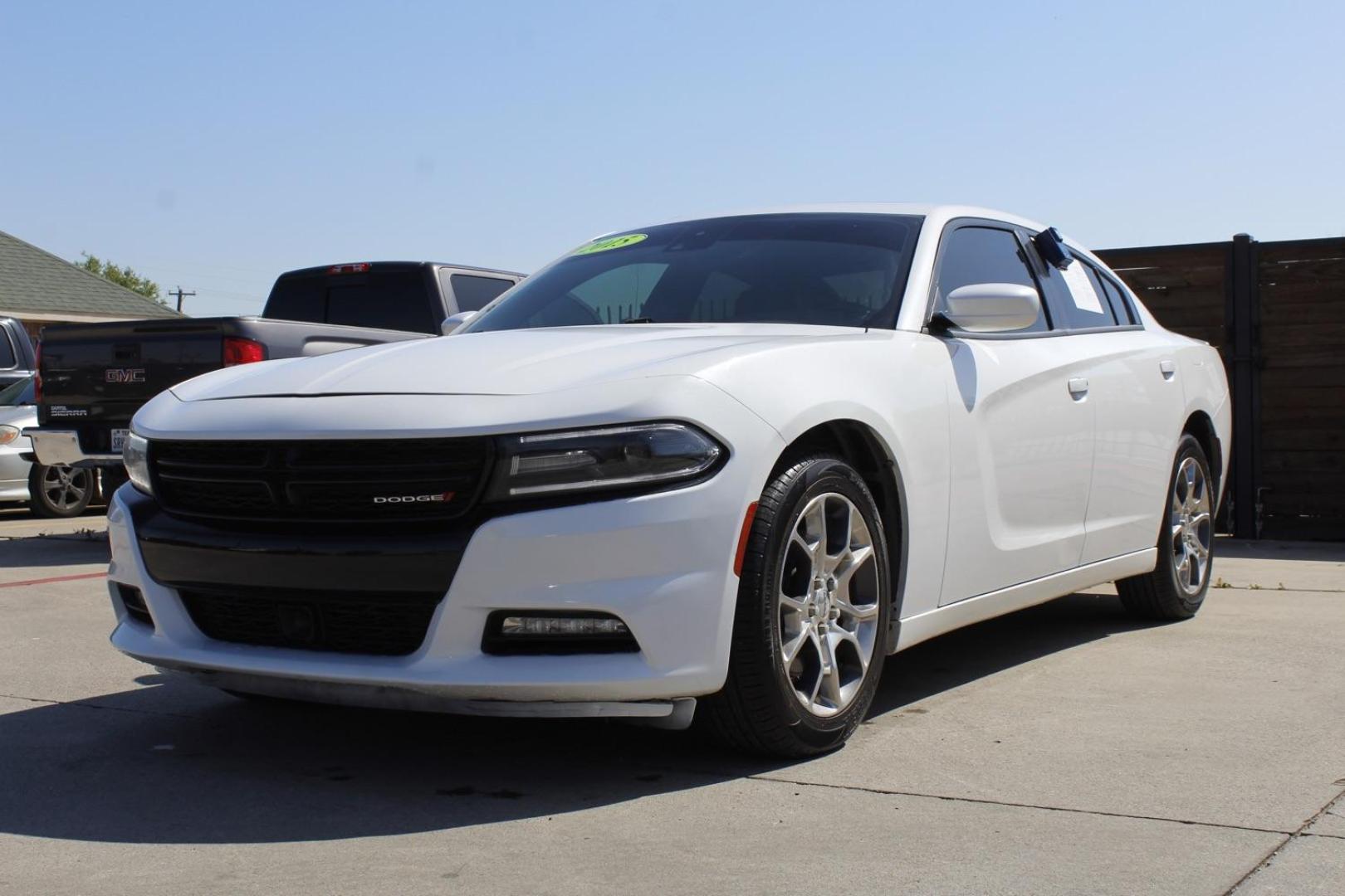 2015 White Dodge Charger SXT AWD (2C3CDXJG9FH) with an 3.6L V6 DOHC 24V engine, 8-Speed Automatic transmission, located at 2401 E Main St., Grand Prairie, TX, 75050, (972) 262-4440, 32.748981, -96.969643 - Photo#1