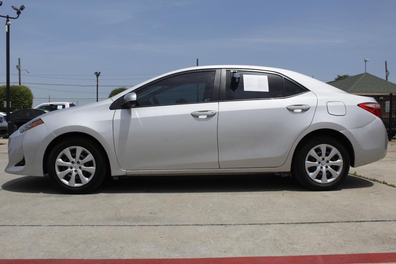 2017 Silver Toyota Corolla LE (5YFBURHE7HP) with an 1.8L I-4 DOHC engine, located at 2401 E Main St., Grand Prairie, TX, 75050, (972) 262-4440, 32.748981, -96.969643 - Photo#2