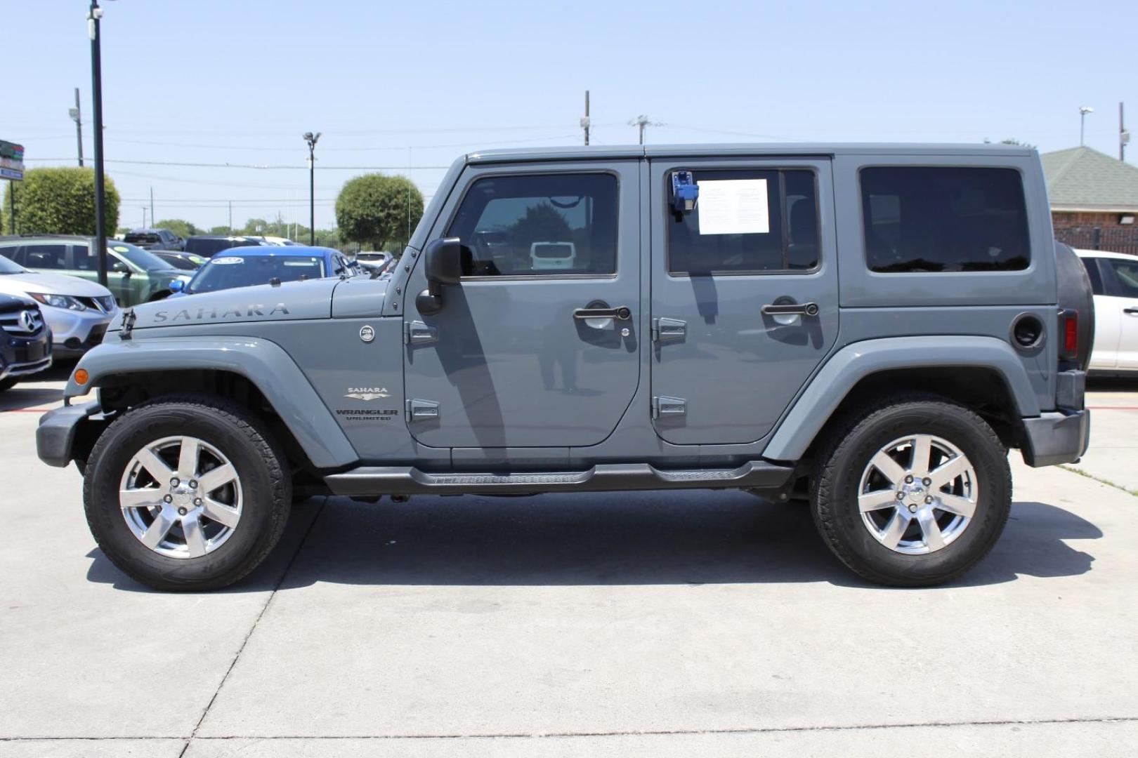 2015 Gray Jeep Wrangler Unlimited Sahara 4WD (1C4BJWEGXFL) with an 3.6L V6 DOHC 24V FFV engine, located at 2401 E Main St., Grand Prairie, TX, 75050, (972) 262-4440, 32.748981, -96.969643 - Photo#2