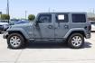 2015 Gray Jeep Wrangler Unlimited Sahara 4WD (1C4BJWEGXFL) with an 3.6L V6 DOHC 24V FFV engine, located at 2401 E Main St., Grand Prairie, TX, 75050, (972) 262-4440, 32.748981, -96.969643 - Photo#2