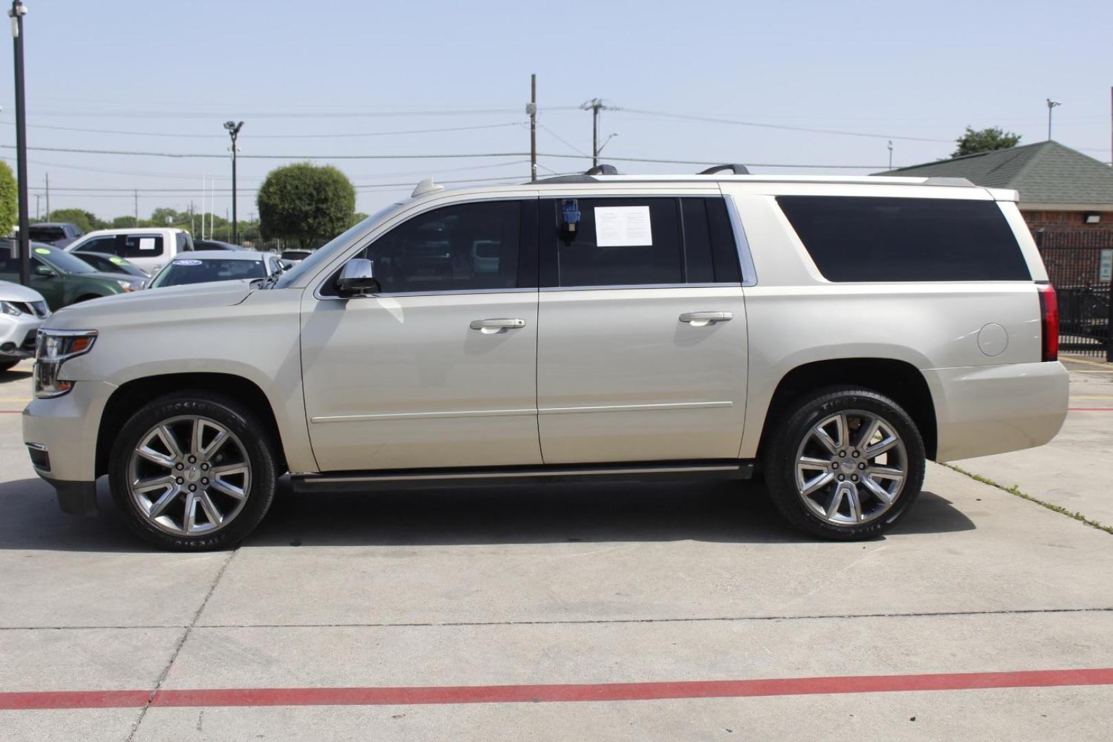 2017 Gold Chevrolet Suburban Premier (1GNSKJKC8HR) with an EcoTec3 5.3L V-8 gasoline direct injection engine, located at 2401 E Main St., Grand Prairie, TX, 75050, (972) 262-4440, 32.748981, -96.969643 - Photo#2