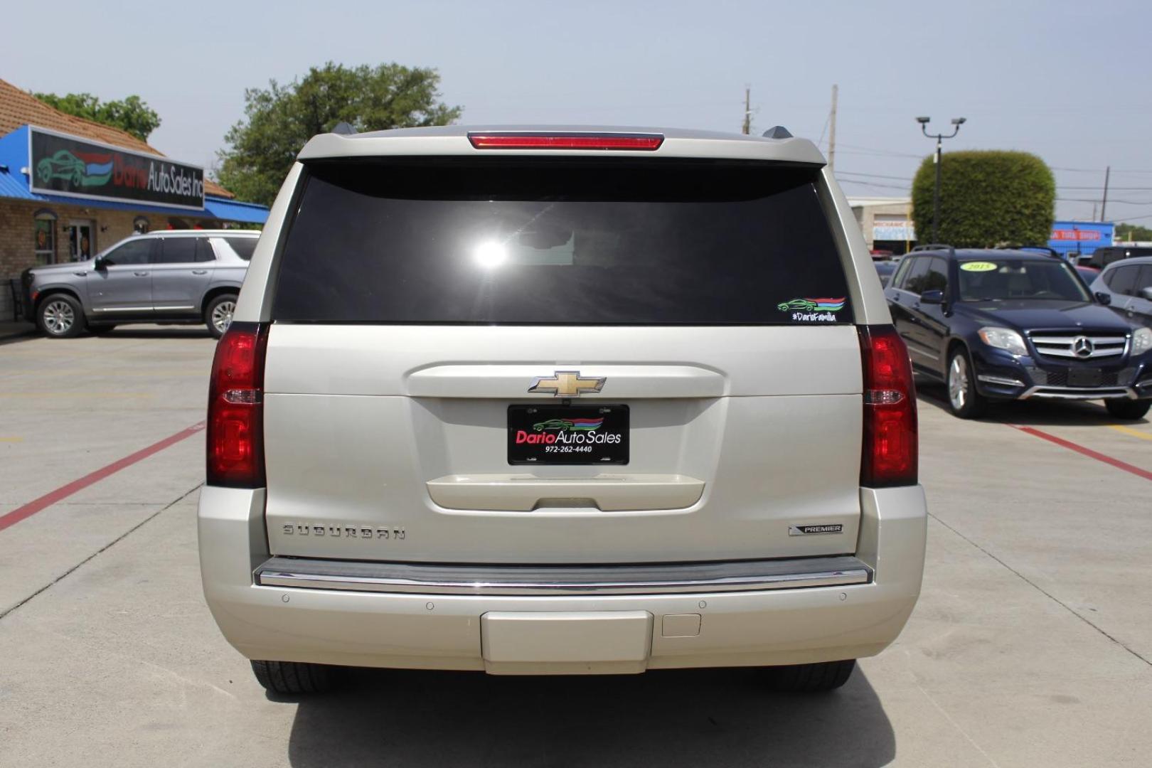 2017 Gold Chevrolet Suburban Premier (1GNSKJKC8HR) with an EcoTec3 5.3L V-8 gasoline direct injection engine, located at 2401 E Main St., Grand Prairie, TX, 75050, (972) 262-4440, 32.748981, -96.969643 - Photo#5