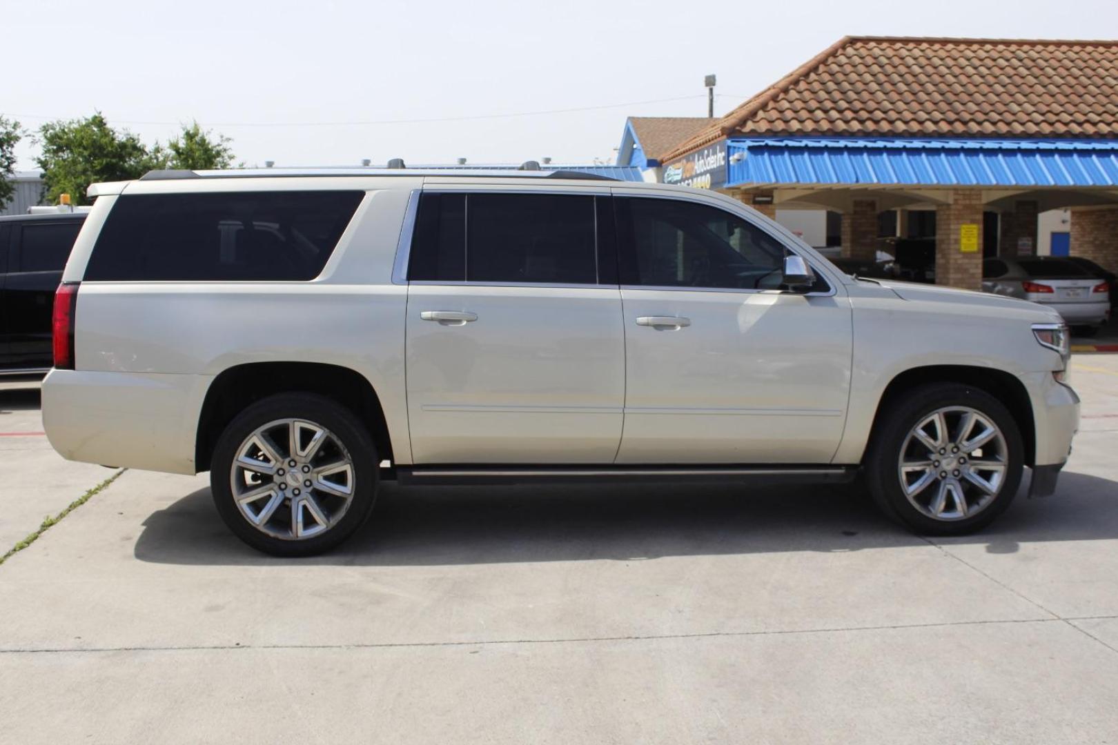 2017 Gold Chevrolet Suburban Premier (1GNSKJKC8HR) with an EcoTec3 5.3L V-8 gasoline direct injection engine, located at 2401 E Main St., Grand Prairie, TX, 75050, (972) 262-4440, 32.748981, -96.969643 - Photo#9