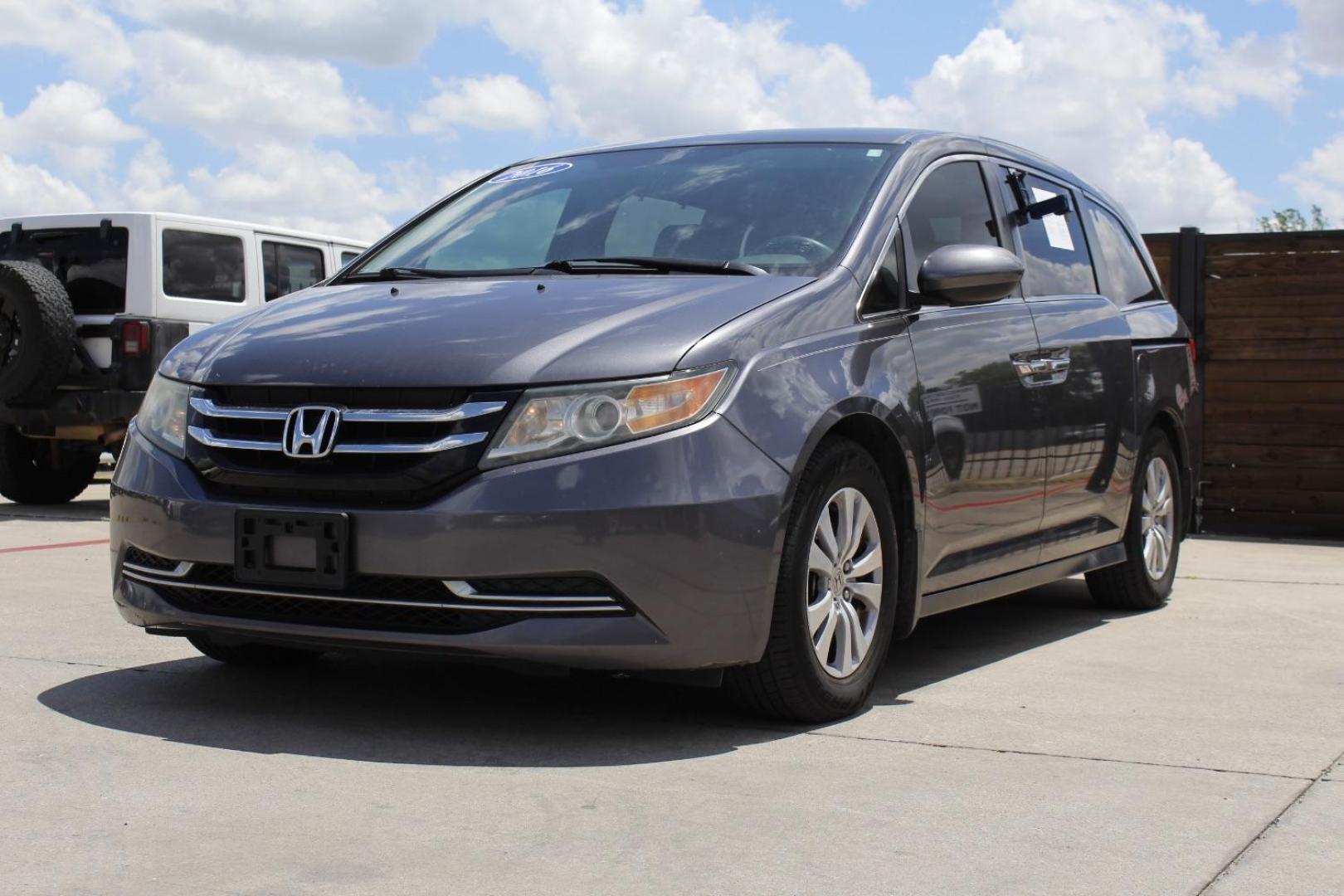 2016 Gray Honda Odyssey SE (5FNRL5H39GB) with an 3.5L V-6 i-VTEC variable valve control engine, located at 2401 E Main St., Grand Prairie, TX, 75050, (972) 262-4440, 32.748981, -96.969643 - Photo#1