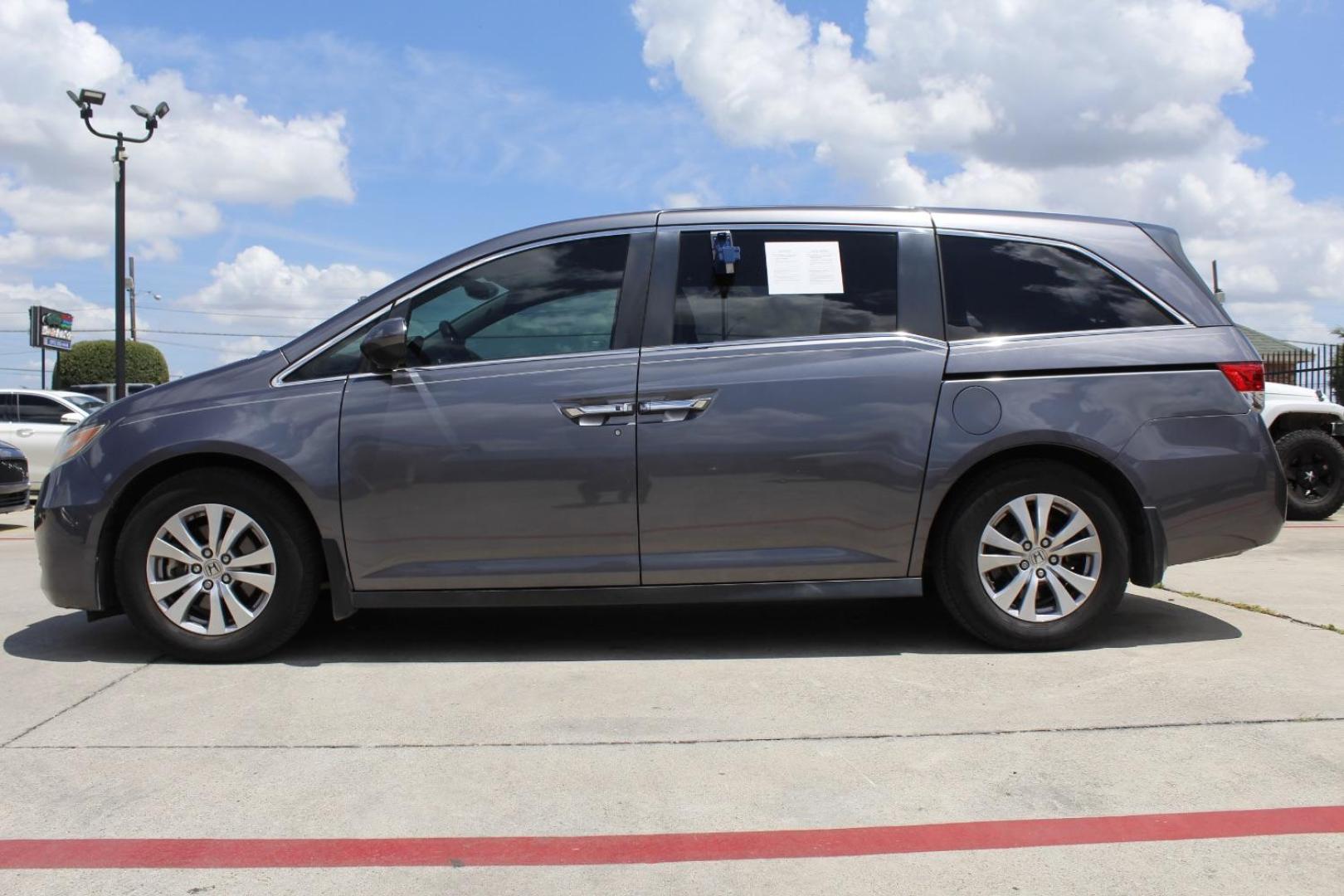 2016 Gray Honda Odyssey SE (5FNRL5H39GB) with an 3.5L V-6 i-VTEC variable valve control engine, located at 2401 E Main St., Grand Prairie, TX, 75050, (972) 262-4440, 32.748981, -96.969643 - Photo#2
