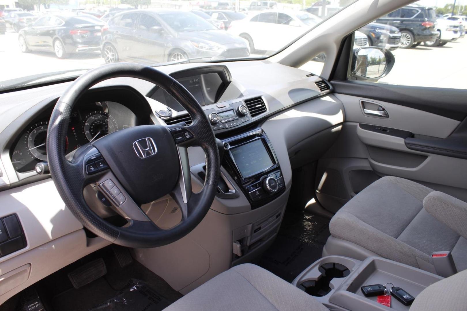 2016 Gray Honda Odyssey SE (5FNRL5H39GB) with an 3.5L V-6 i-VTEC variable valve control engine, located at 2401 E Main St., Grand Prairie, TX, 75050, (972) 262-4440, 32.748981, -96.969643 - Photo#12