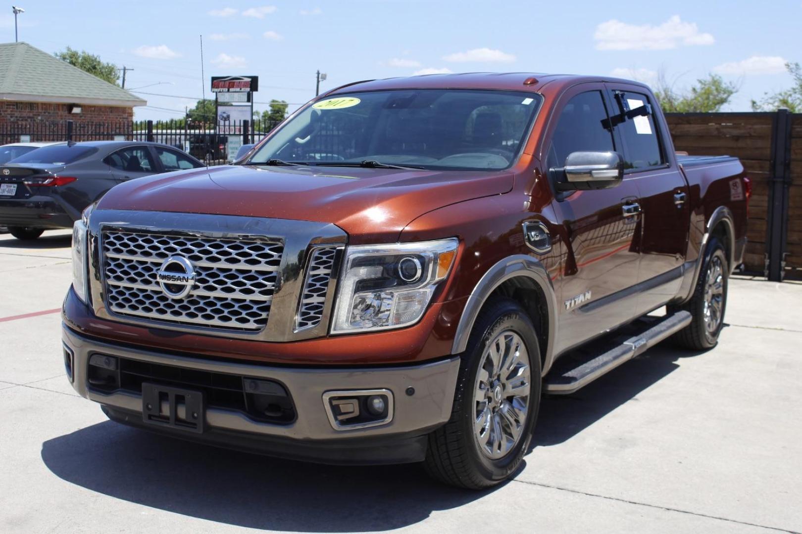 2017 Orange Nissan TITAN Platinum Reserve (1N6AA1E61HN) with an Endurance 5.6L V-8 gasoline direct injection engine, located at 2401 E Main St., Grand Prairie, TX, 75050, (972) 262-4440, 32.748981, -96.969643 - Photo#1