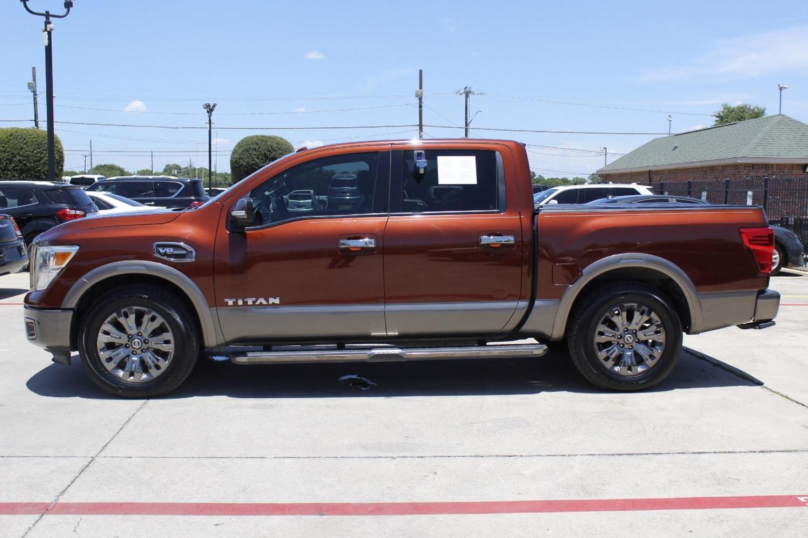 2017 Orange Nissan TITAN Platinum Reserve (1N6AA1E61HN) with an Endurance 5.6L V-8 gasoline direct injection engine, located at 2401 E Main St., Grand Prairie, TX, 75050, (972) 262-4440, 32.748981, -96.969643 - Photo#2