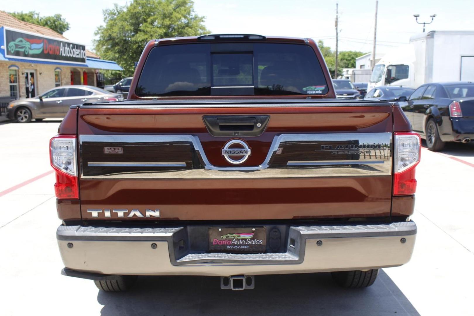 2017 Orange Nissan TITAN Platinum Reserve (1N6AA1E61HN) with an Endurance 5.6L V-8 gasoline direct injection engine, located at 2401 E Main St., Grand Prairie, TX, 75050, (972) 262-4440, 32.748981, -96.969643 - Photo#6