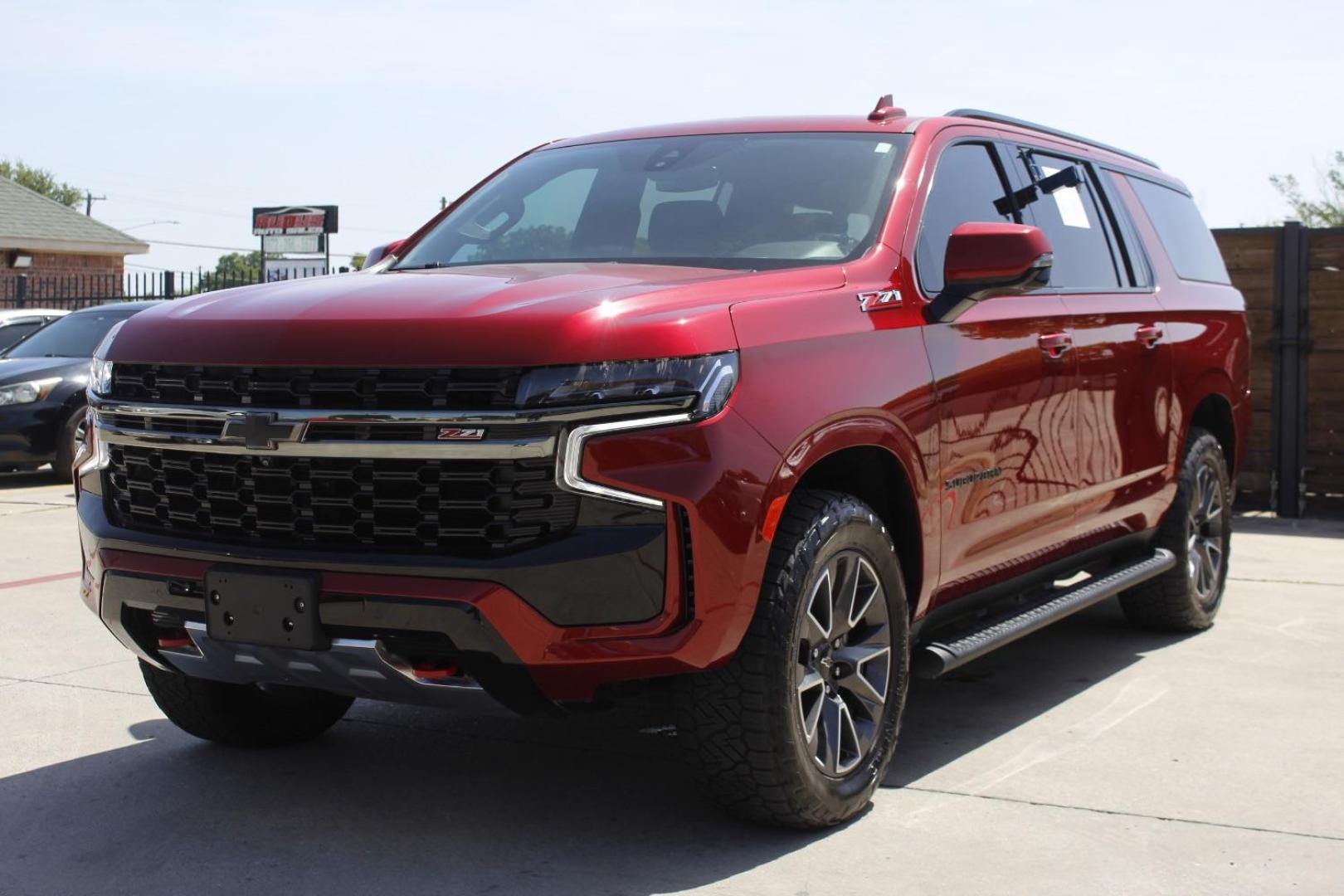 2021 Red Chevrolet Suburban 4WD Z71 (1GNSKDKD5MR) with an EcoTec3 5.3L V-8 gasoline direct injection engine, located at 2401 E Main St., Grand Prairie, TX, 75050, (972) 262-4440, 32.748981, -96.969643 - Photo#1