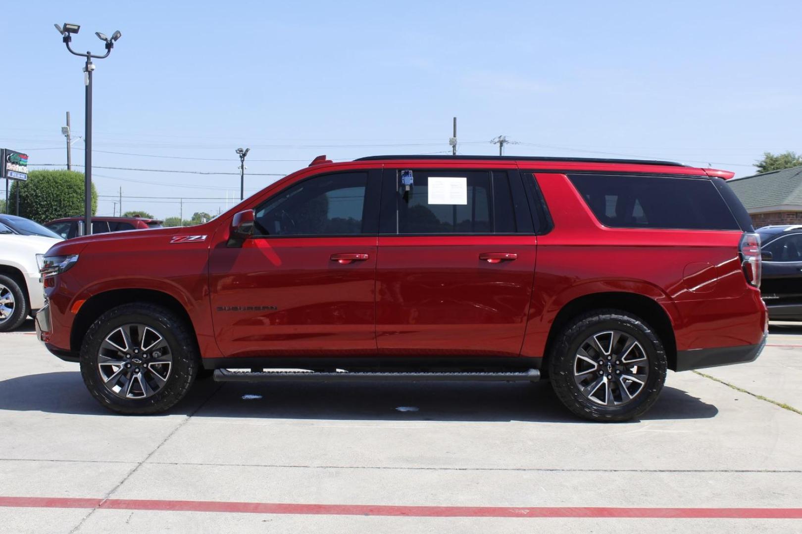 2021 Red Chevrolet Suburban 4WD Z71 (1GNSKDKD5MR) with an EcoTec3 5.3L V-8 gasoline direct injection engine, located at 2401 E Main St., Grand Prairie, TX, 75050, (972) 262-4440, 32.748981, -96.969643 - Photo#2