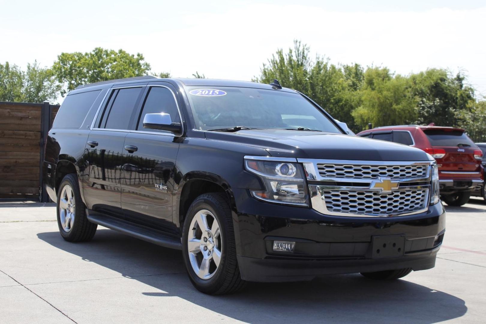 2015 Black Chevrolet Suburban 1500 LT (1GNSCJKC5FR) with an EcoTec3 5.3L V-8 gasoline direct injection engine, located at 2401 E Main St., Grand Prairie, TX, 75050, (972) 262-4440, 32.748981, -96.969643 - Photo#1