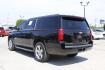 2015 Black Chevrolet Suburban 1500 (1GNSCJKC5FR) with an EcoTec3 5.3L V-8 gasoline direct injection engine, located at 2401 E Main St., Grand Prairie, TX, 75050, (972) 262-4440, 32.748981, -96.969643 - Photo#18