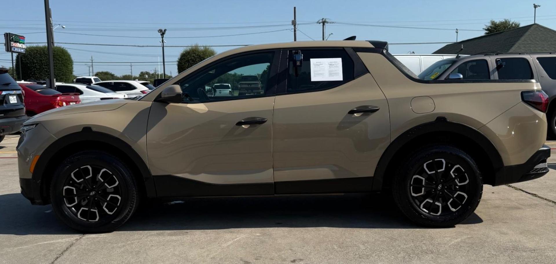 2023 Tan Hyundai Santa Cruz SEL (5NTJBDAE7PH) with an Smartstream 2.5L I-4 port/direct injection engine, located at 2401 E Main St., Grand Prairie, TX, 75050, (972) 262-4440, 32.748981, -96.969643 - Photo#2