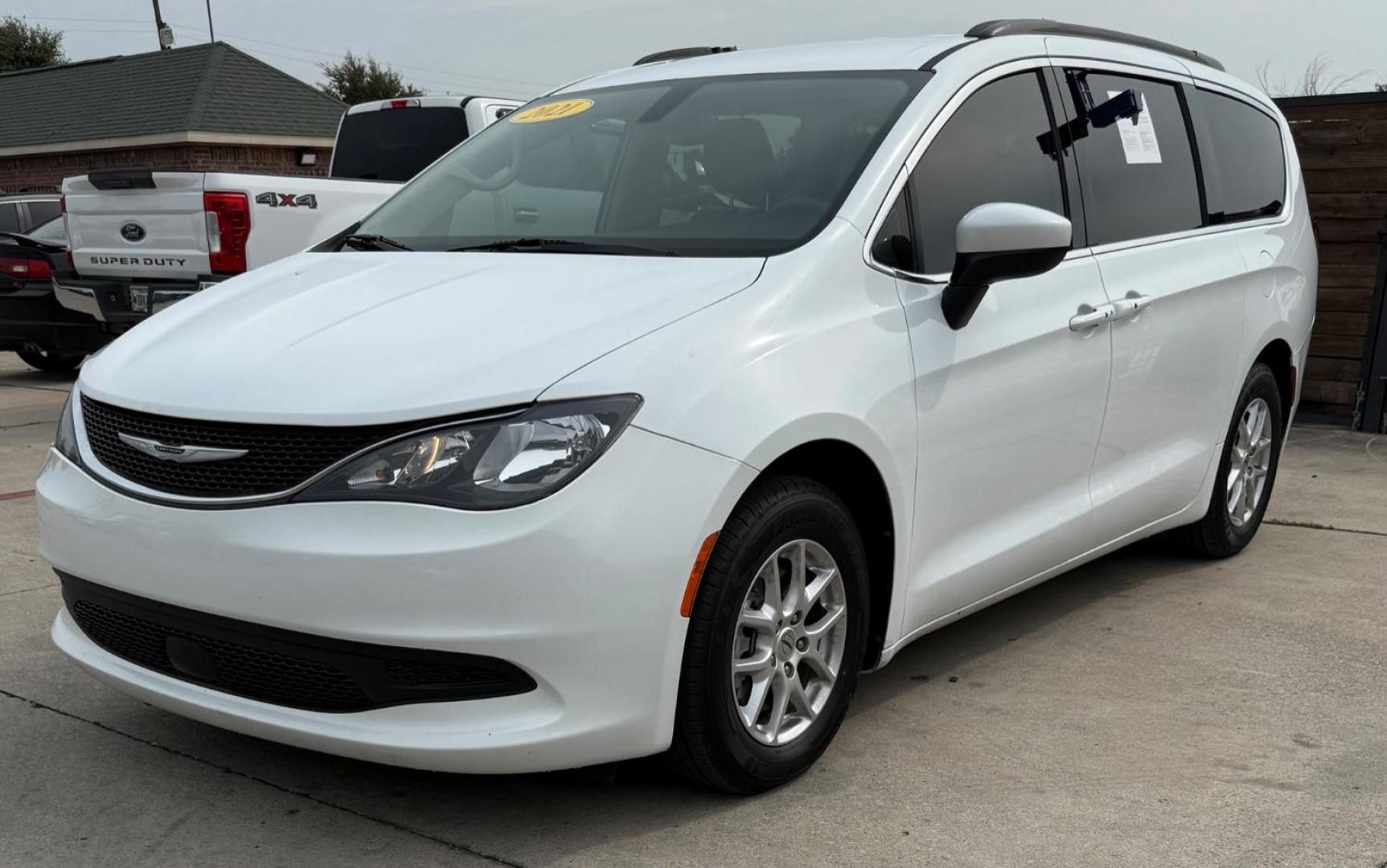 2021 White Chrysler Voyager LXI (2C4RC1DG0MR) with an 3.6L V-6 DOHC engine, located at 2401 E Main St., Grand Prairie, TX, 75050, (972) 262-4440, 32.748981, -96.969643 - Photo#1