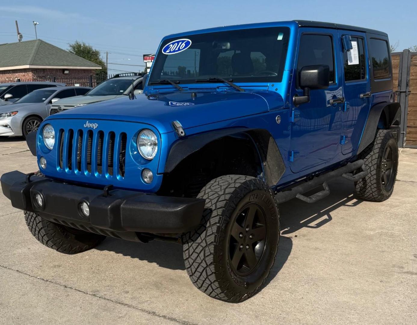 2016 Blue Jeep Wrangler Unlimited Sport (1C4BJWDG3GL) with an Pentastar 3.6L V-6 DOHC engine, located at 2401 E Main St., Grand Prairie, TX, 75050, (972) 262-4440, 32.748981, -96.969643 - Photo#2
