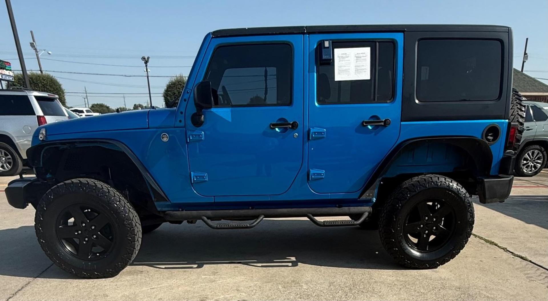 2016 Blue Jeep Wrangler Unlimited Sport (1C4BJWDG3GL) with an Pentastar 3.6L V-6 DOHC engine, located at 2401 E Main St., Grand Prairie, TX, 75050, (972) 262-4440, 32.748981, -96.969643 - Photo#4