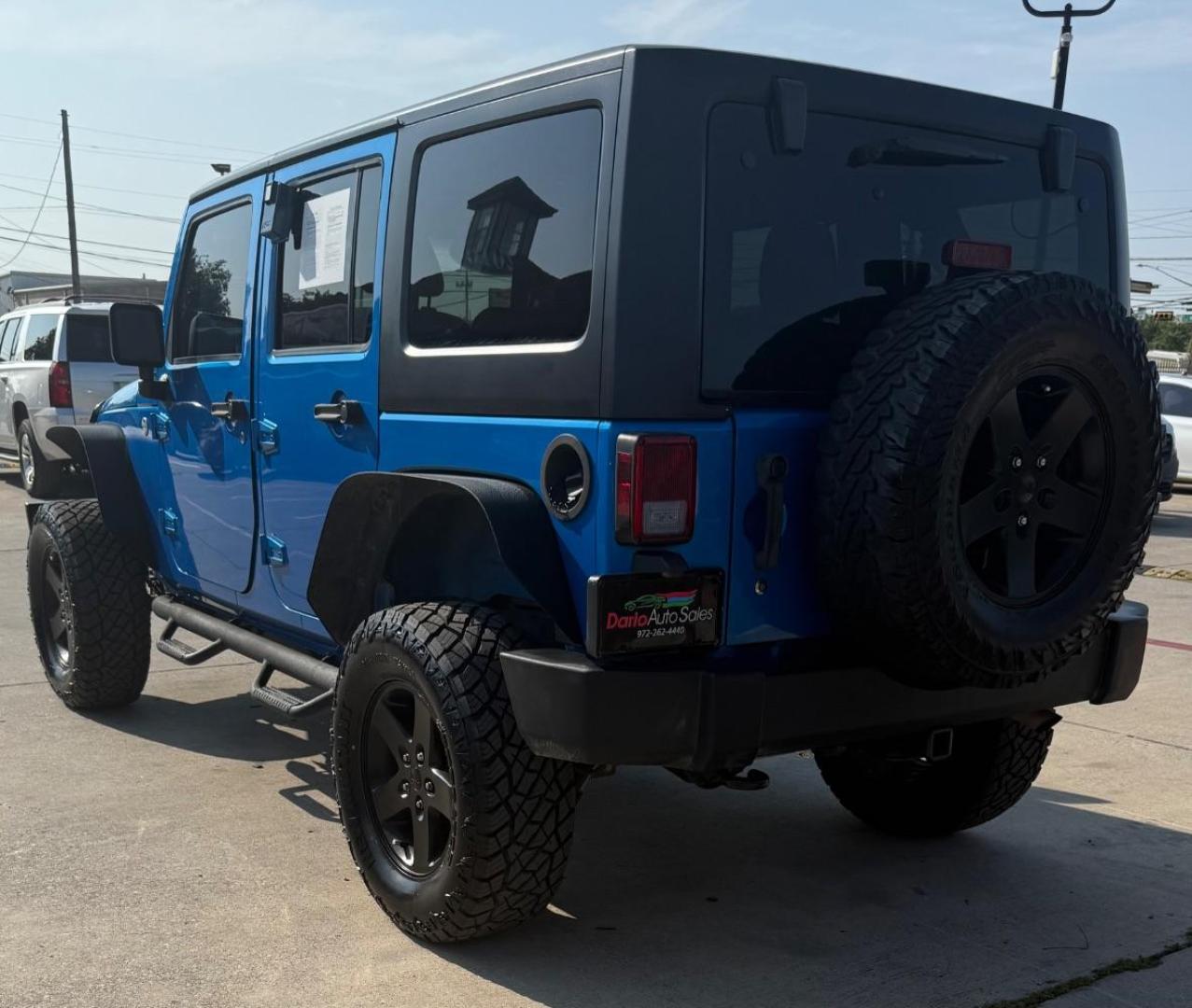 2016 Blue Jeep Wrangler Unlimited Sport (1C4BJWDG3GL) with an Pentastar 3.6L V-6 DOHC engine, located at 2401 E Main St., Grand Prairie, TX, 75050, (972) 262-4440, 32.748981, -96.969643 - Photo#5