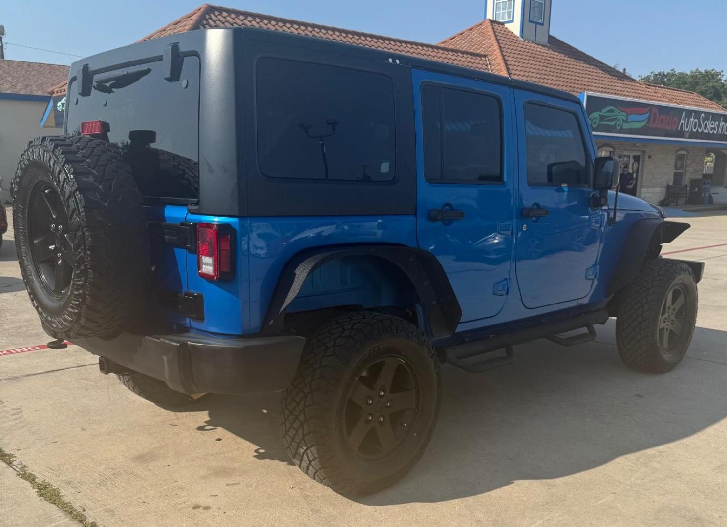 2016 Blue Jeep Wrangler Unlimited Sport (1C4BJWDG3GL) with an Pentastar 3.6L V-6 DOHC engine, located at 2401 E Main St., Grand Prairie, TX, 75050, (972) 262-4440, 32.748981, -96.969643 - Photo#7