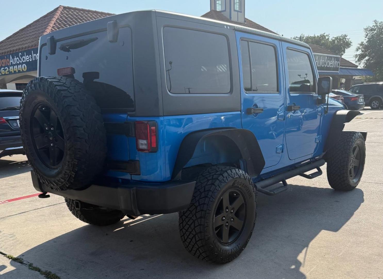 2016 Blue Jeep Wrangler Unlimited Sport (1C4BJWDG3GL) with an Pentastar 3.6L V-6 DOHC engine, located at 2401 E Main St., Grand Prairie, TX, 75050, (972) 262-4440, 32.748981, -96.969643 - Photo#8