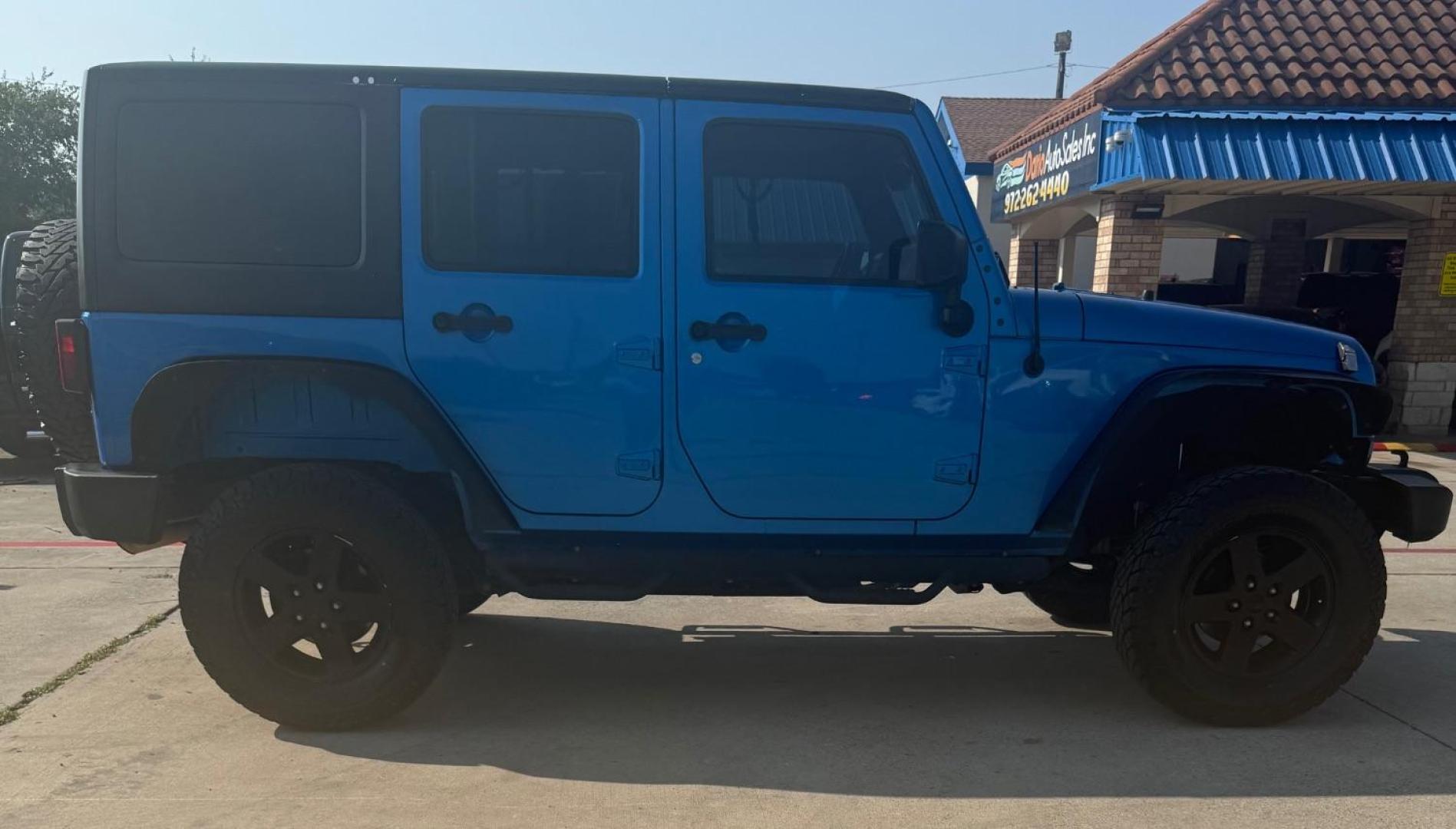 2016 Blue Jeep Wrangler Unlimited Sport (1C4BJWDG3GL) with an Pentastar 3.6L V-6 DOHC engine, located at 2401 E Main St., Grand Prairie, TX, 75050, (972) 262-4440, 32.748981, -96.969643 - Photo#9