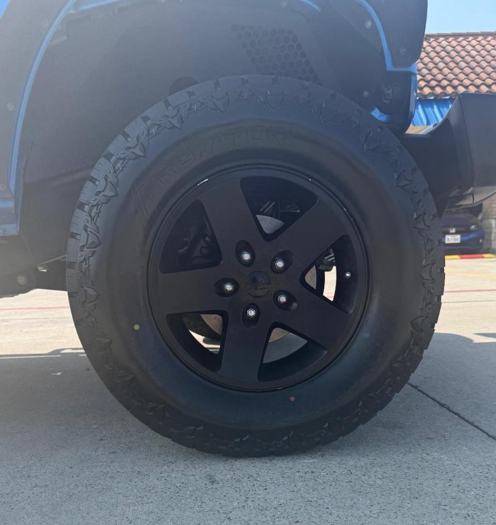2016 Blue Jeep Wrangler Unlimited Sport (1C4BJWDG3GL) with an Pentastar 3.6L V-6 DOHC engine, located at 2401 E Main St., Grand Prairie, TX, 75050, (972) 262-4440, 32.748981, -96.969643 - Photo#11