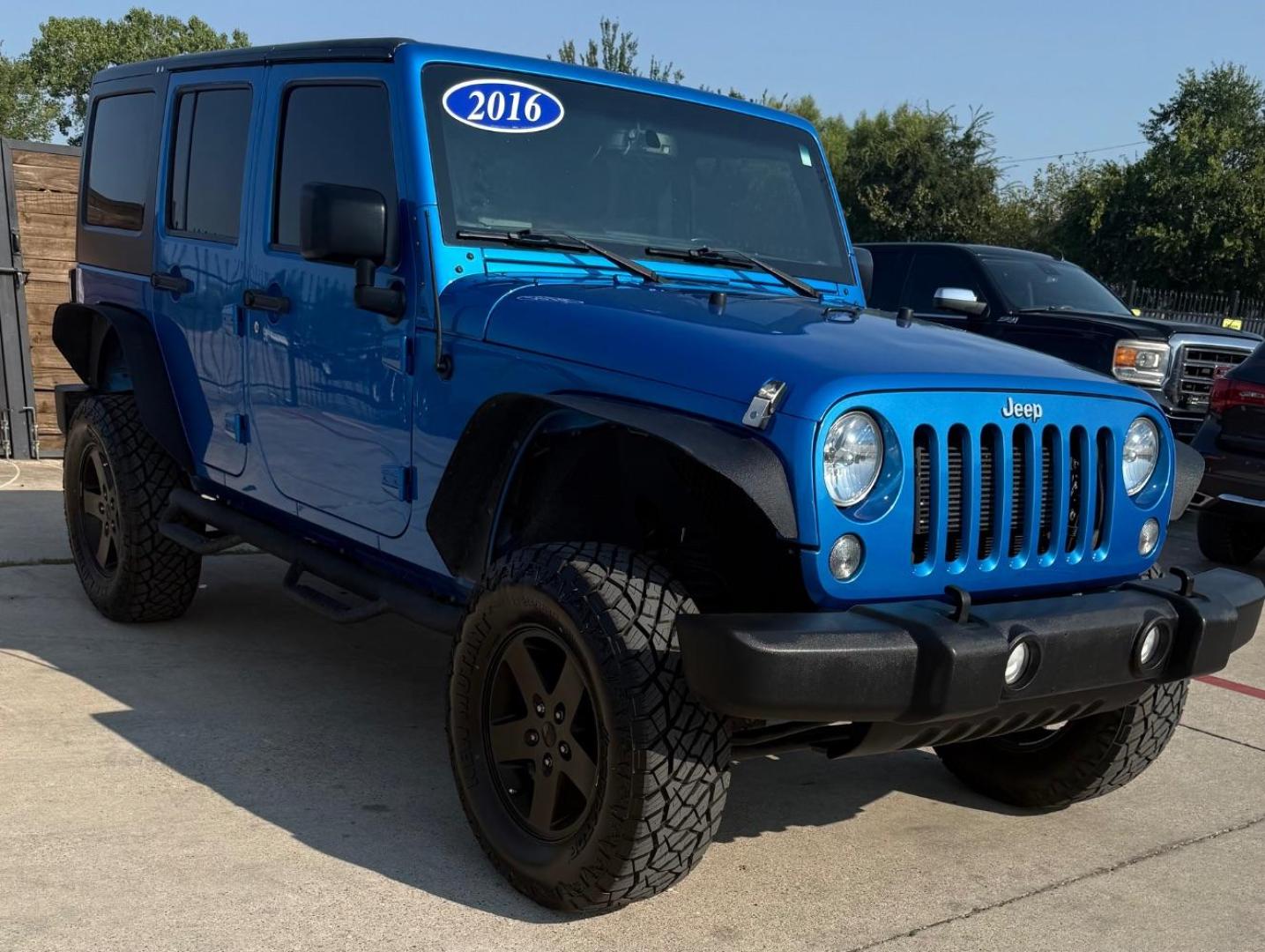 2016 Blue Jeep Wrangler Unlimited Sport (1C4BJWDG3GL) with an Pentastar 3.6L V-6 DOHC engine, located at 2401 E Main St., Grand Prairie, TX, 75050, (972) 262-4440, 32.748981, -96.969643 - Photo#12