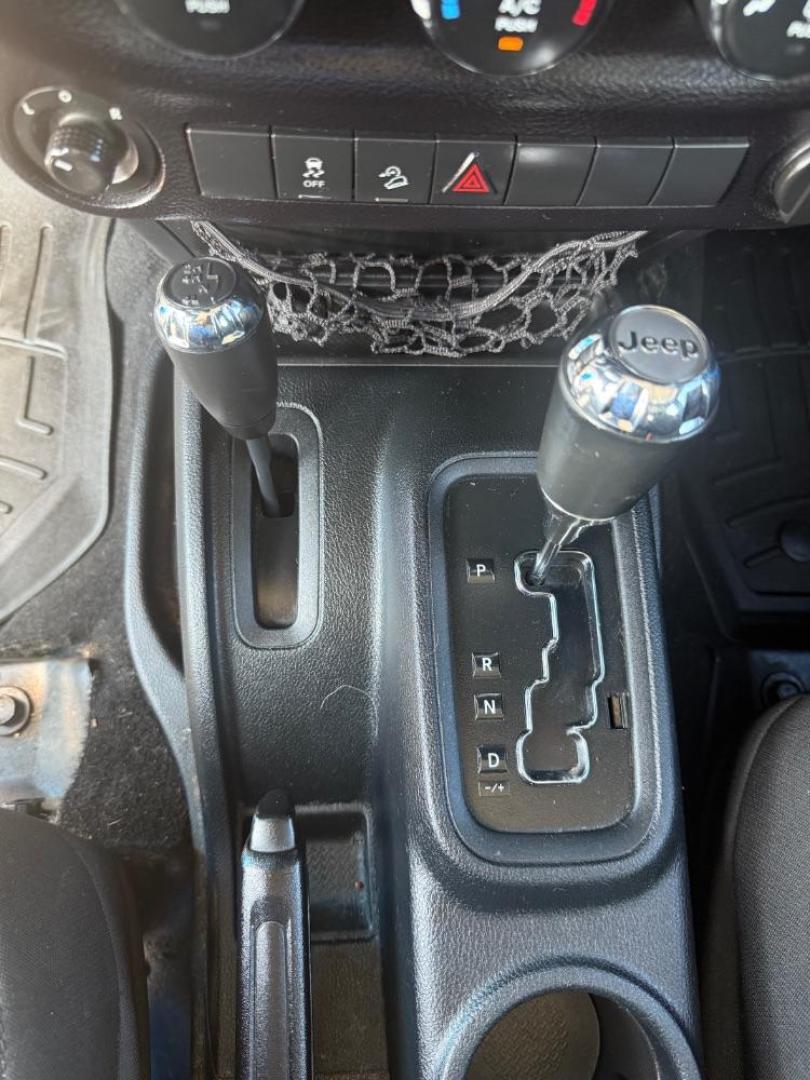 2016 Blue Jeep Wrangler Unlimited Sport (1C4BJWDG3GL) with an Pentastar 3.6L V-6 DOHC engine, located at 2401 E Main St., Grand Prairie, TX, 75050, (972) 262-4440, 32.748981, -96.969643 - Photo#19