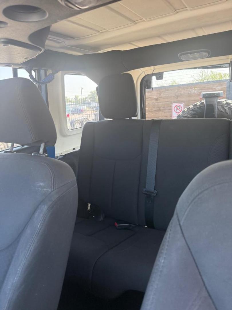 2016 Blue Jeep Wrangler Unlimited Sport (1C4BJWDG3GL) with an Pentastar 3.6L V-6 DOHC engine, located at 2401 E Main St., Grand Prairie, TX, 75050, (972) 262-4440, 32.748981, -96.969643 - Photo#21