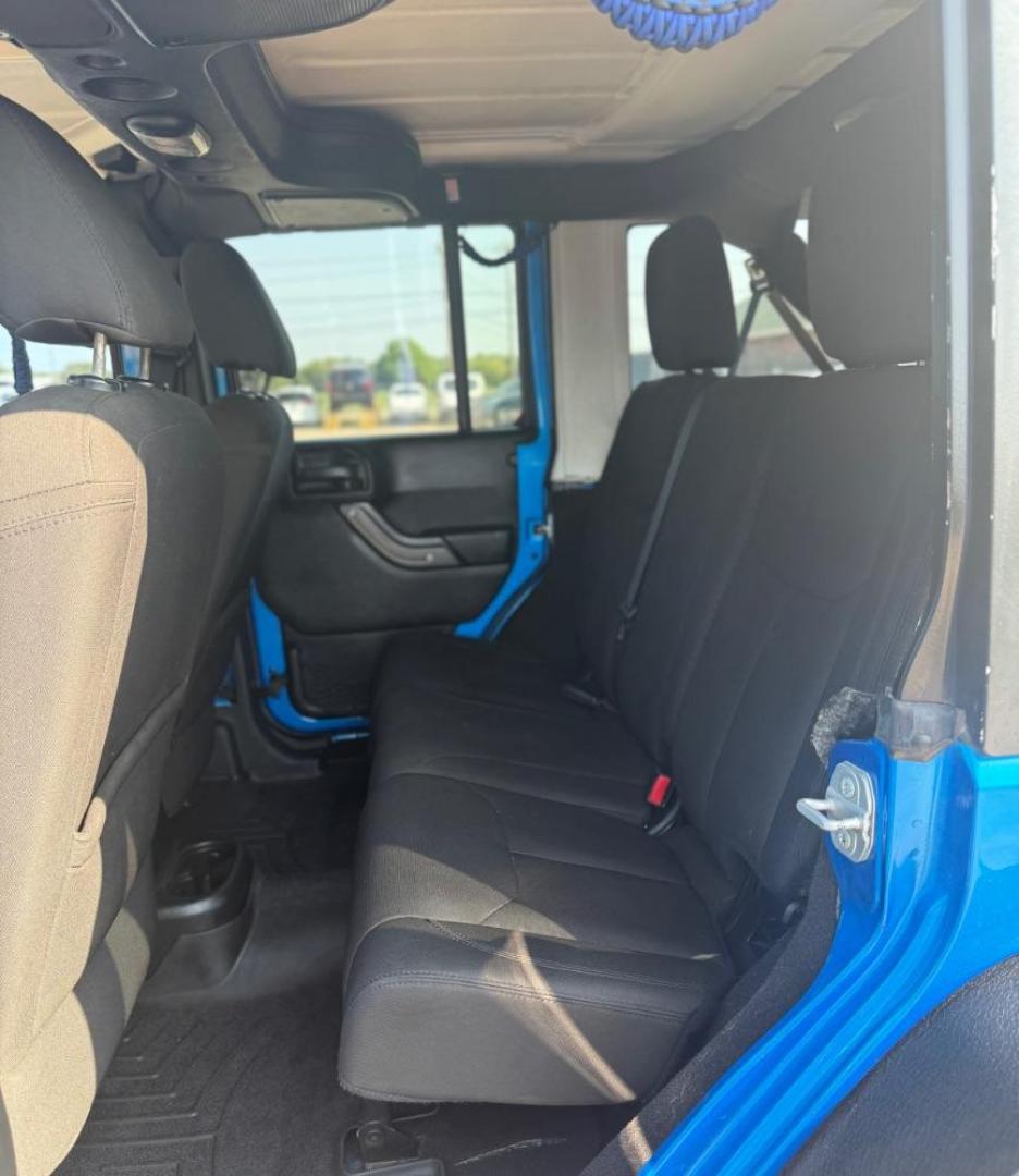 2016 Blue Jeep Wrangler Unlimited Sport (1C4BJWDG3GL) with an Pentastar 3.6L V-6 DOHC engine, located at 2401 E Main St., Grand Prairie, TX, 75050, (972) 262-4440, 32.748981, -96.969643 - Photo#22