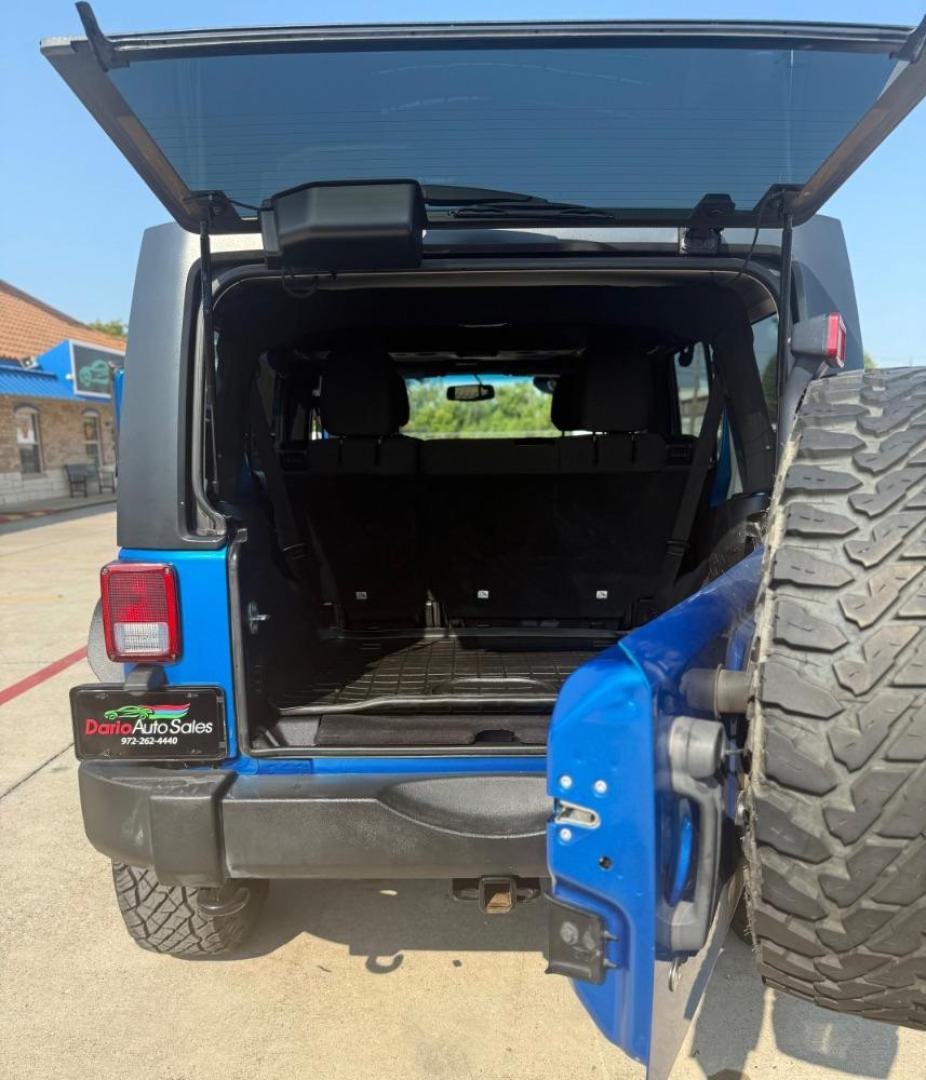 2016 Blue Jeep Wrangler Unlimited Sport (1C4BJWDG3GL) with an Pentastar 3.6L V-6 DOHC engine, located at 2401 E Main St., Grand Prairie, TX, 75050, (972) 262-4440, 32.748981, -96.969643 - Photo#25