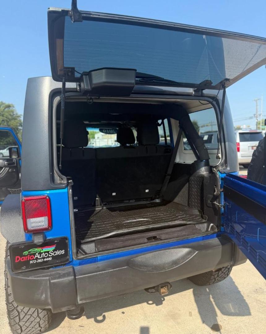 2016 Blue Jeep Wrangler Unlimited Sport (1C4BJWDG3GL) with an Pentastar 3.6L V-6 DOHC engine, located at 2401 E Main St., Grand Prairie, TX, 75050, (972) 262-4440, 32.748981, -96.969643 - Photo#27