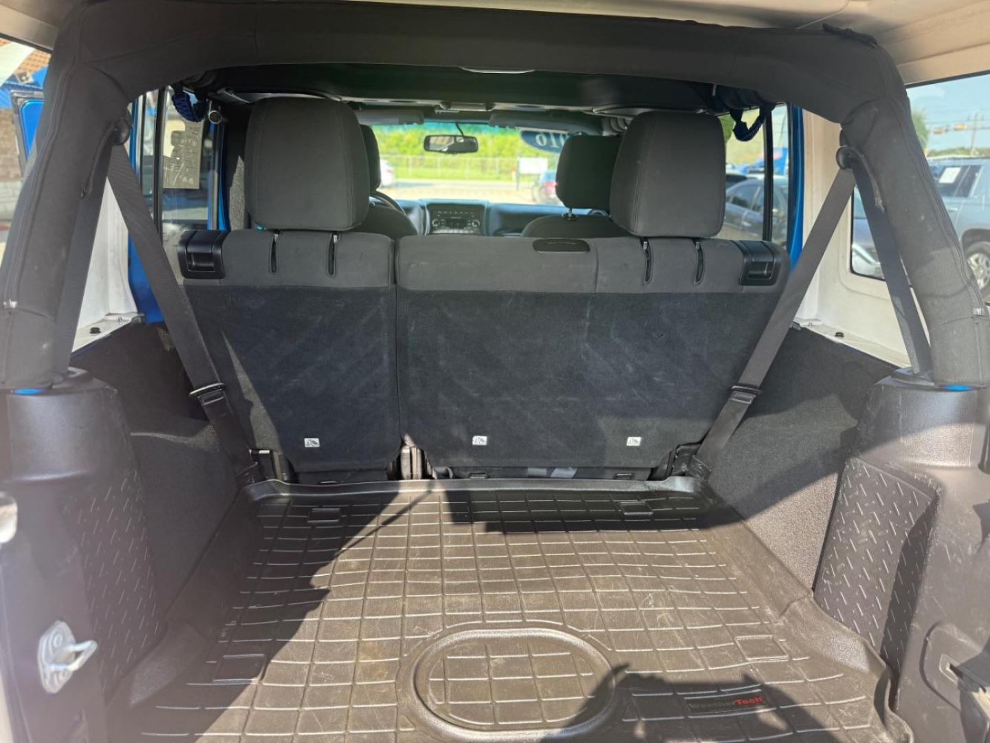 2016 Blue Jeep Wrangler Unlimited Sport (1C4BJWDG3GL) with an Pentastar 3.6L V-6 DOHC engine, located at 2401 E Main St., Grand Prairie, TX, 75050, (972) 262-4440, 32.748981, -96.969643 - Photo#29