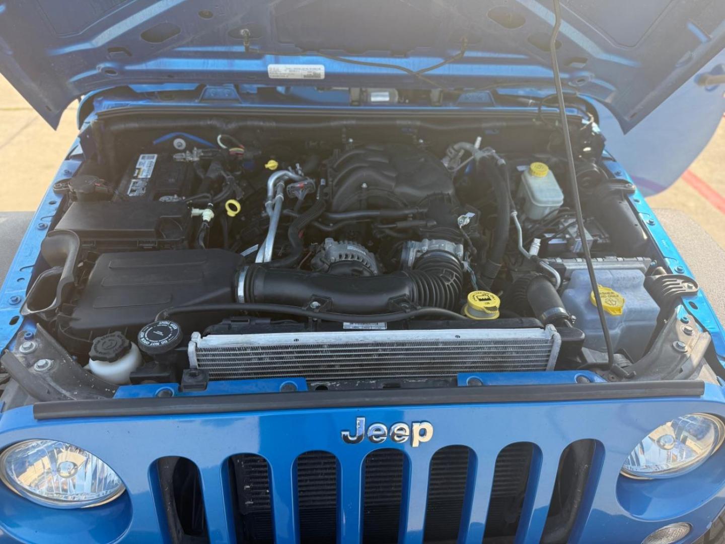 2016 Blue Jeep Wrangler Unlimited Sport (1C4BJWDG3GL) with an Pentastar 3.6L V-6 DOHC engine, located at 2401 E Main St., Grand Prairie, TX, 75050, (972) 262-4440, 32.748981, -96.969643 - Photo#30