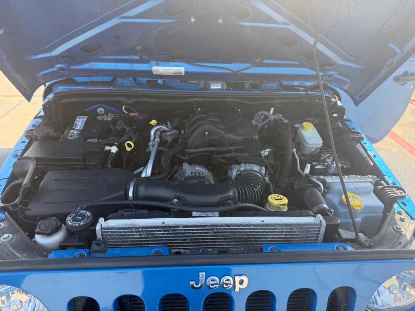 2016 Blue Jeep Wrangler Unlimited Sport (1C4BJWDG3GL) with an Pentastar 3.6L V-6 DOHC engine, located at 2401 E Main St., Grand Prairie, TX, 75050, (972) 262-4440, 32.748981, -96.969643 - Photo#32