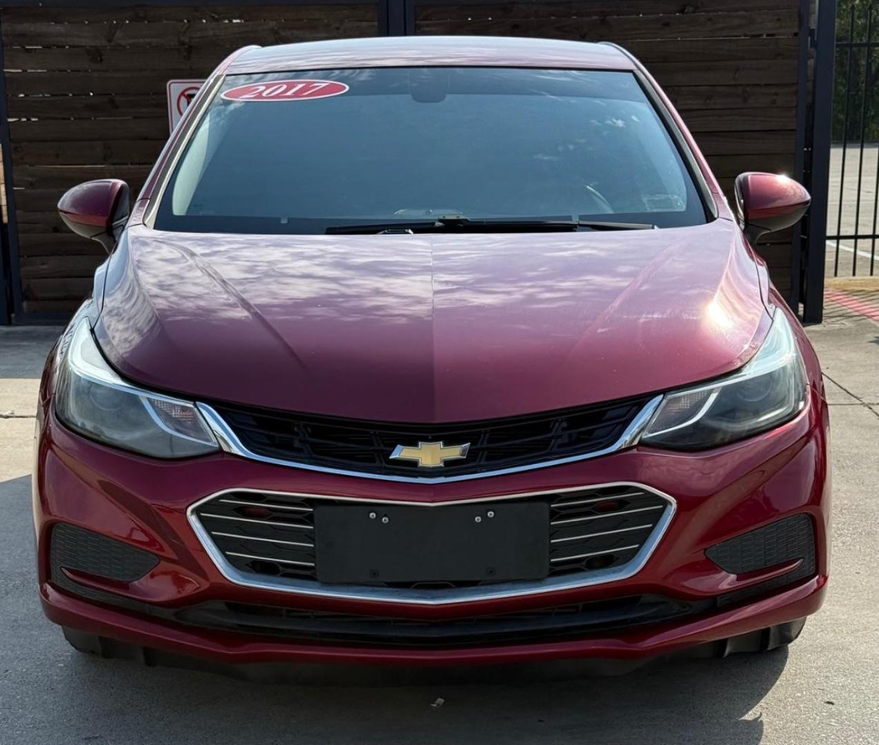 2017 Red Chevrolet Cruze LT Auto (3G1BE6SM3HS) with an 1.4L I-4 gasoline direct injection engine, located at 2401 E Main St., Grand Prairie, TX, 75050, (972) 262-4440, 32.748981, -96.969643 - Photo#0