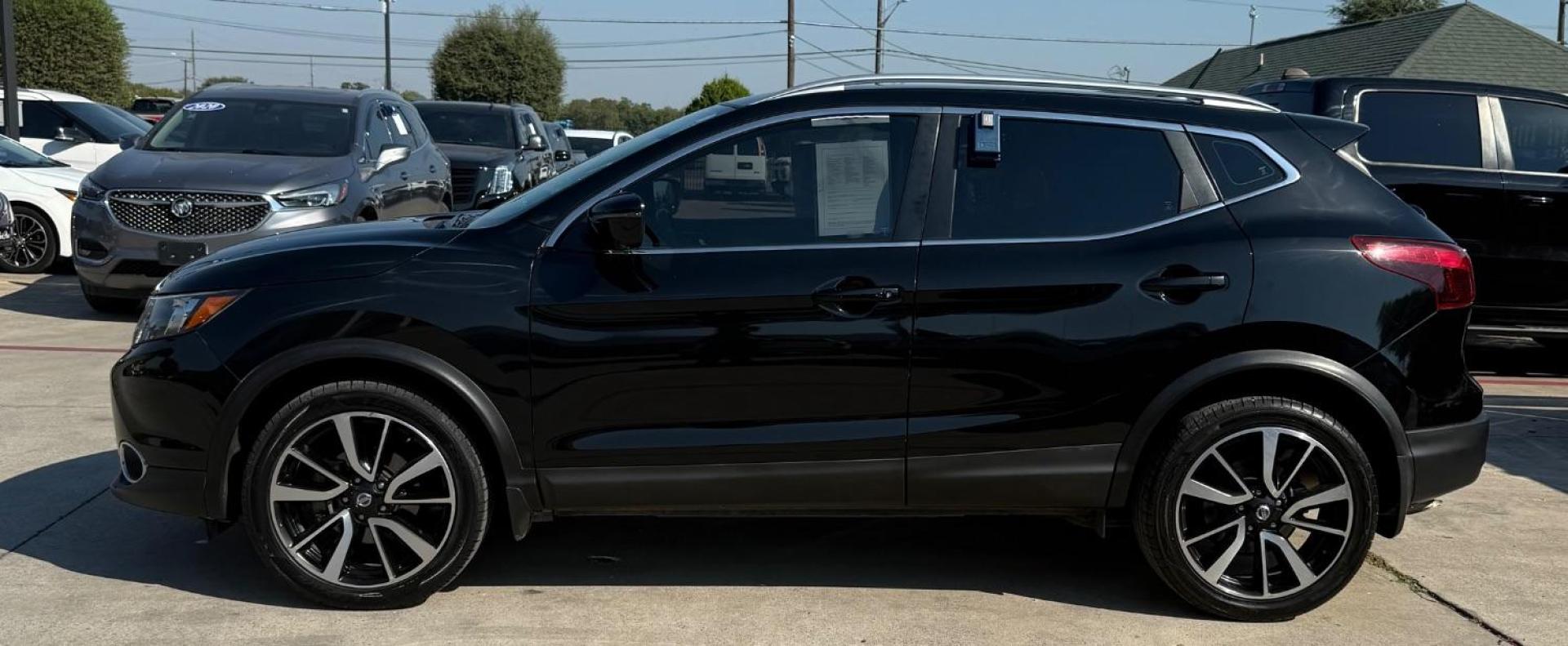 2018 Black Nissan Rogue Sport SL (JN1BJ1CP9JW) with an 2L I-4 gasoline direct injection engine, located at 2401 E Main St., Grand Prairie, TX, 75050, (972) 262-4440, 32.748981, -96.969643 - Photo#4