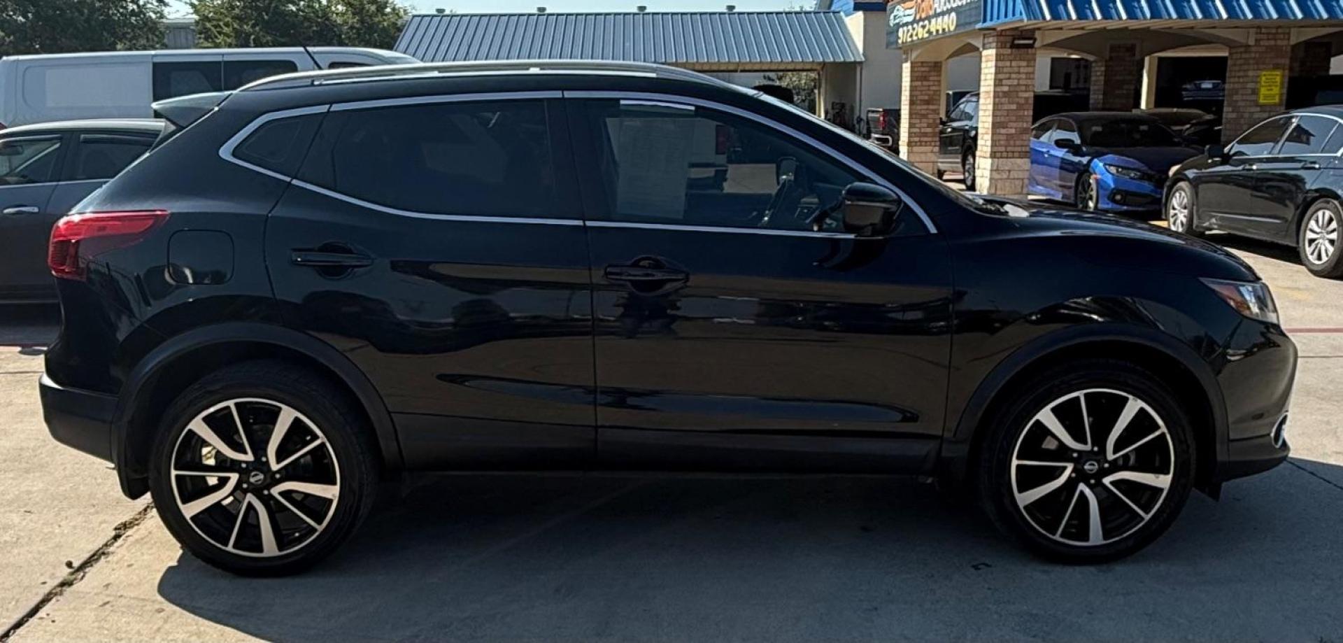 2018 Black Nissan Rogue Sport SL (JN1BJ1CP9JW) with an 2L I-4 gasoline direct injection engine, located at 2401 E Main St., Grand Prairie, TX, 75050, (972) 262-4440, 32.748981, -96.969643 - Photo#16
