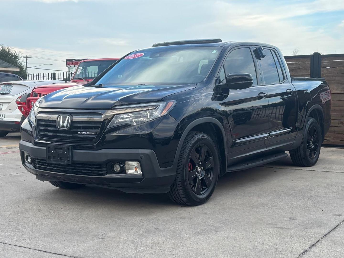 2017 Black Honda Ridgeline Black Edition (5FPYK3F84HB) with an 3.5L V-6 gasoline direct injection engine, located at 2401 E Main St., Grand Prairie, TX, 75050, (972) 262-4440, 32.748981, -96.969643 - Photo#2