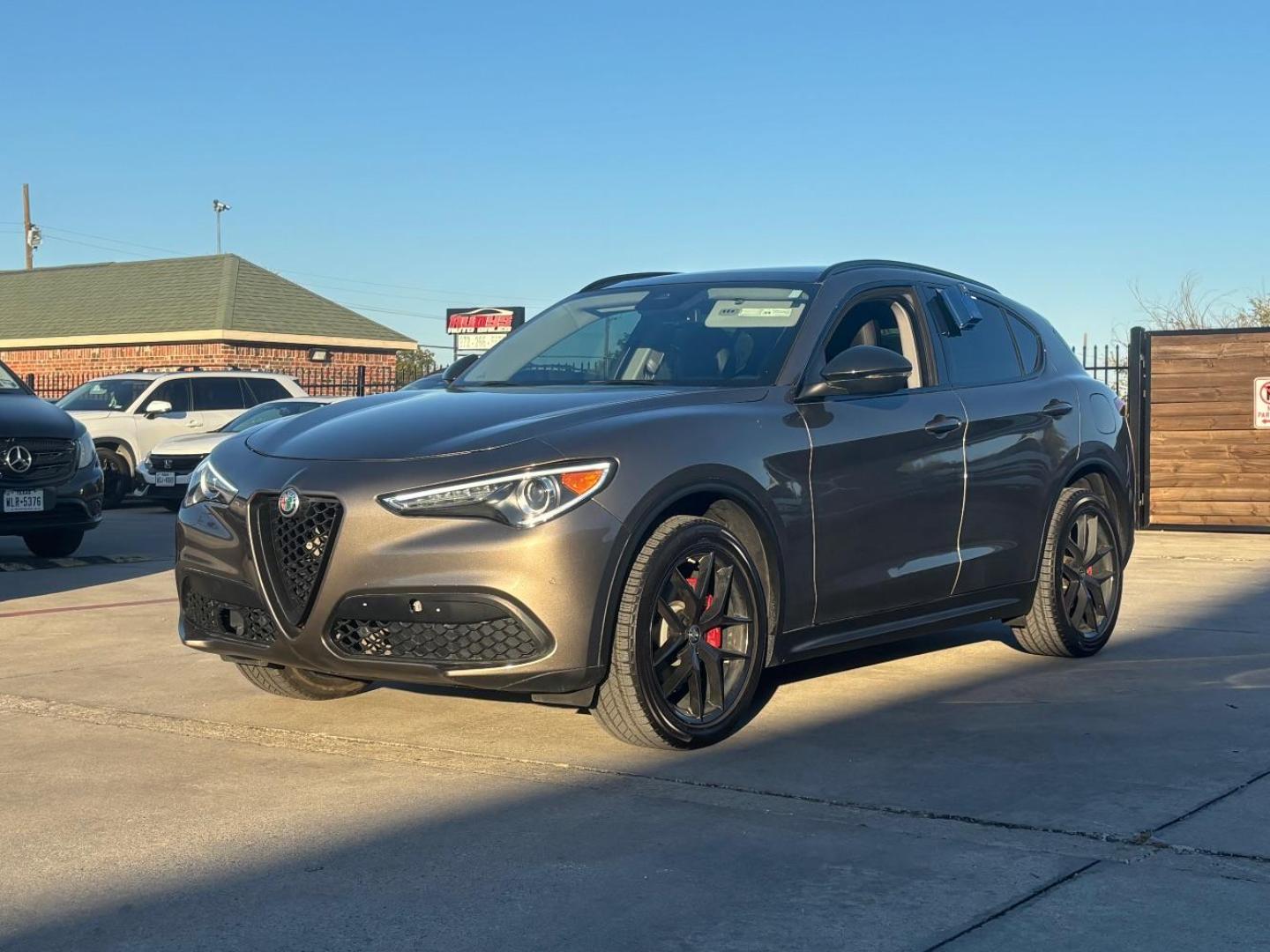 2019 Gray Alfa Romeo Stelvio Ti AWD (ZASPAKBN3K7) with an 2L I-4 gasoline direct injection engine, located at 2401 E Main St., Grand Prairie, TX, 75050, (972) 262-4440, 32.748981, -96.969643 - Photo#1