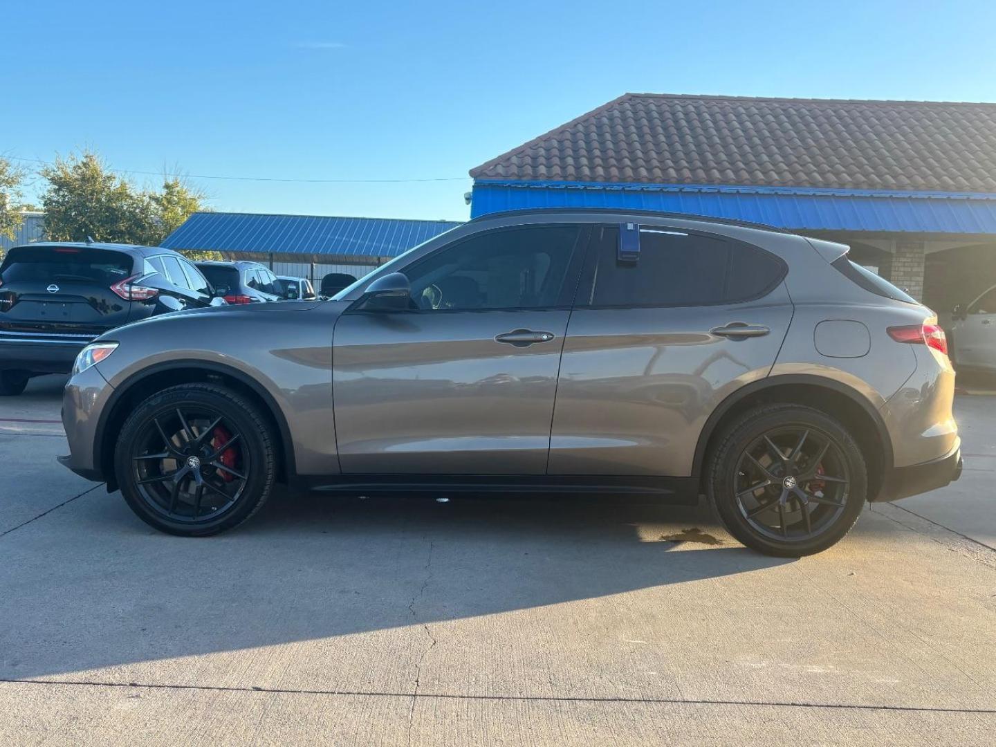 2019 Gray Alfa Romeo Stelvio Ti AWD (ZASPAKBN3K7) with an 2L I-4 gasoline direct injection engine, located at 2401 E Main St., Grand Prairie, TX, 75050, (972) 262-4440, 32.748981, -96.969643 - Photo#10