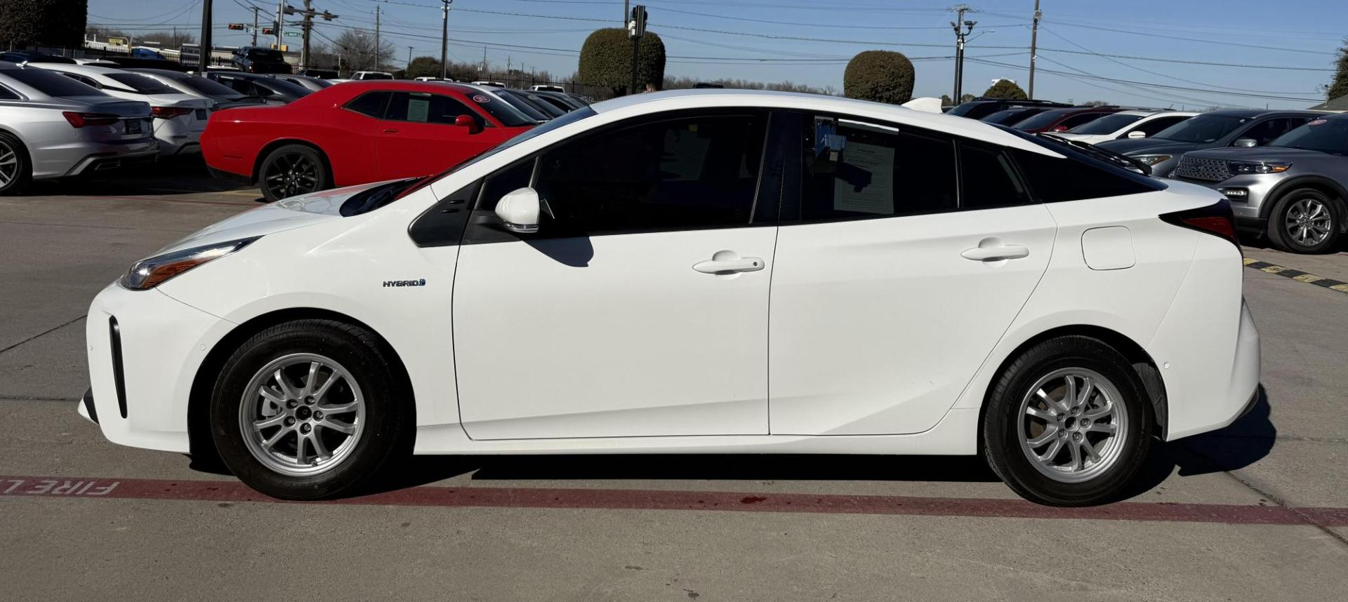 2021 Wind Chill Pearl /Black, cloth Harvest Beige, cloth Moonstone, cloth Toyota Prius 74087 (JTDKAMFU5M3) with an 1.8L L4 DOHC 16V HYBRID engine, Continuously Variable Transmission transmission, located at 2401 E Main St., Grand Prairie, TX, 75050, (972) 262-4440, 32.748981, -96.969643 - Photo#1