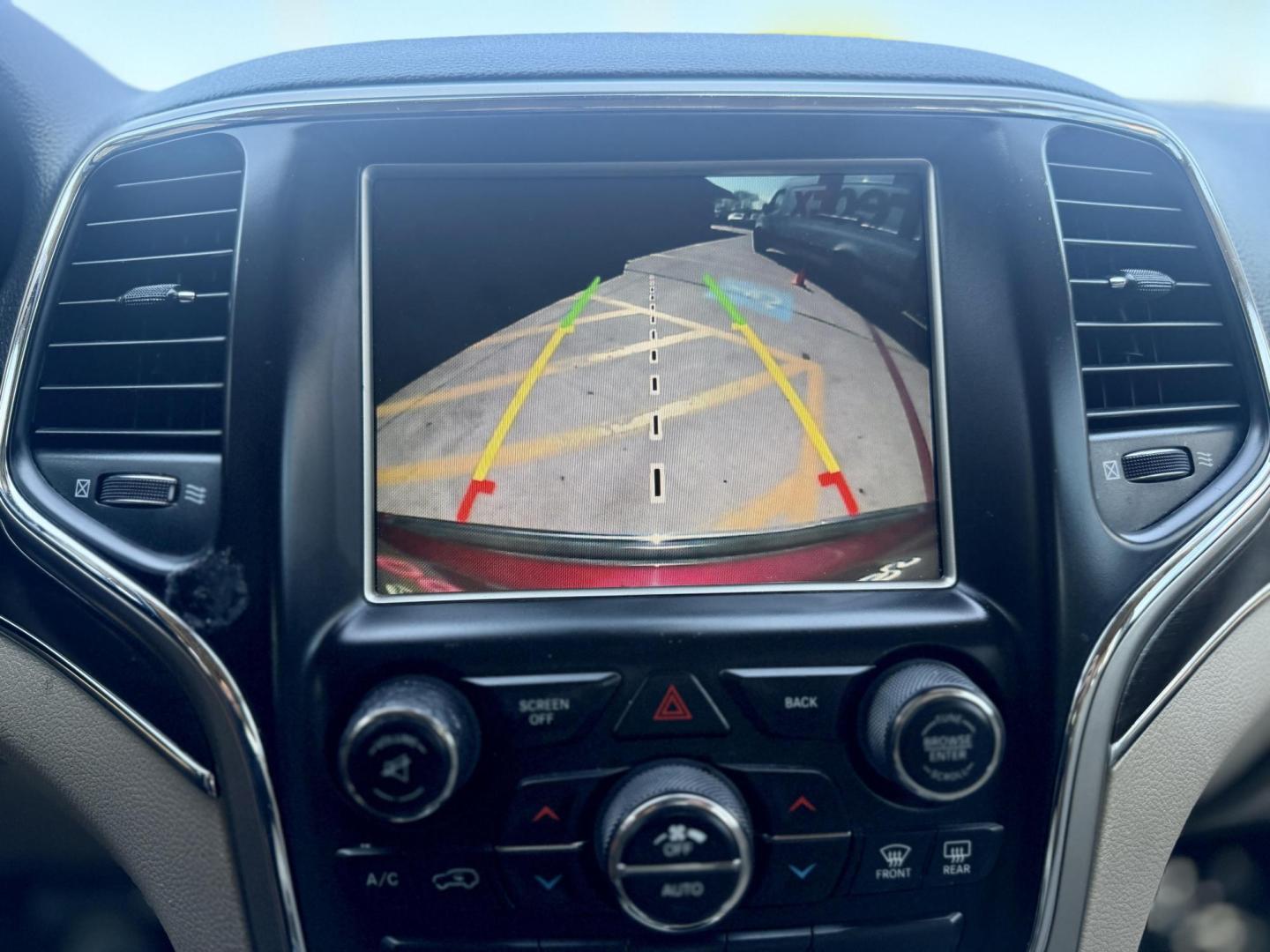 2015 Dp Cherry Red Crystal PC /Black Light Frost Beige/Black Jeep Grand Cherokee 50287 (1C4RJFBG3FC) with an 3.6L V6 DOHC 24V engine, 8-Speed Automatic transmission, located at 2401 E Main St., Grand Prairie, TX, 75050, (972) 262-4440, 32.748981, -96.969643 - Photo#17