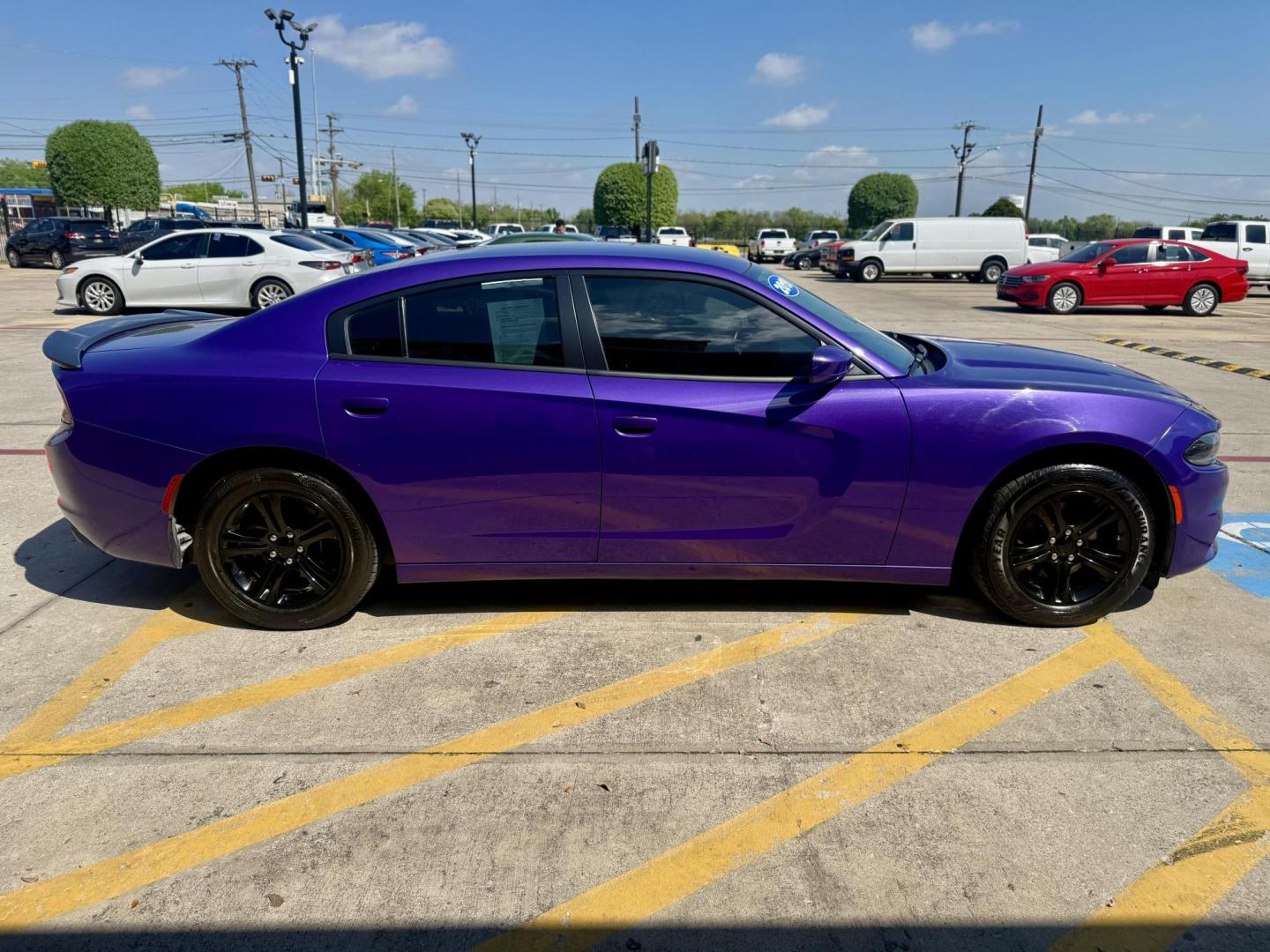 2019 Plum Crazy Pearl Coat /Black, cloth Black, leather Black/Brazen Gold, lea Dodge Charger 65048 (2C3CDXBG4KH) with an 3.6L V6 DOHC 24V engine, 8-Speed Automatic transmission, located at 2401 E Main St., Grand Prairie, TX, 75050, (972) 262-4440, 32.748981, -96.969643 - Photo#5