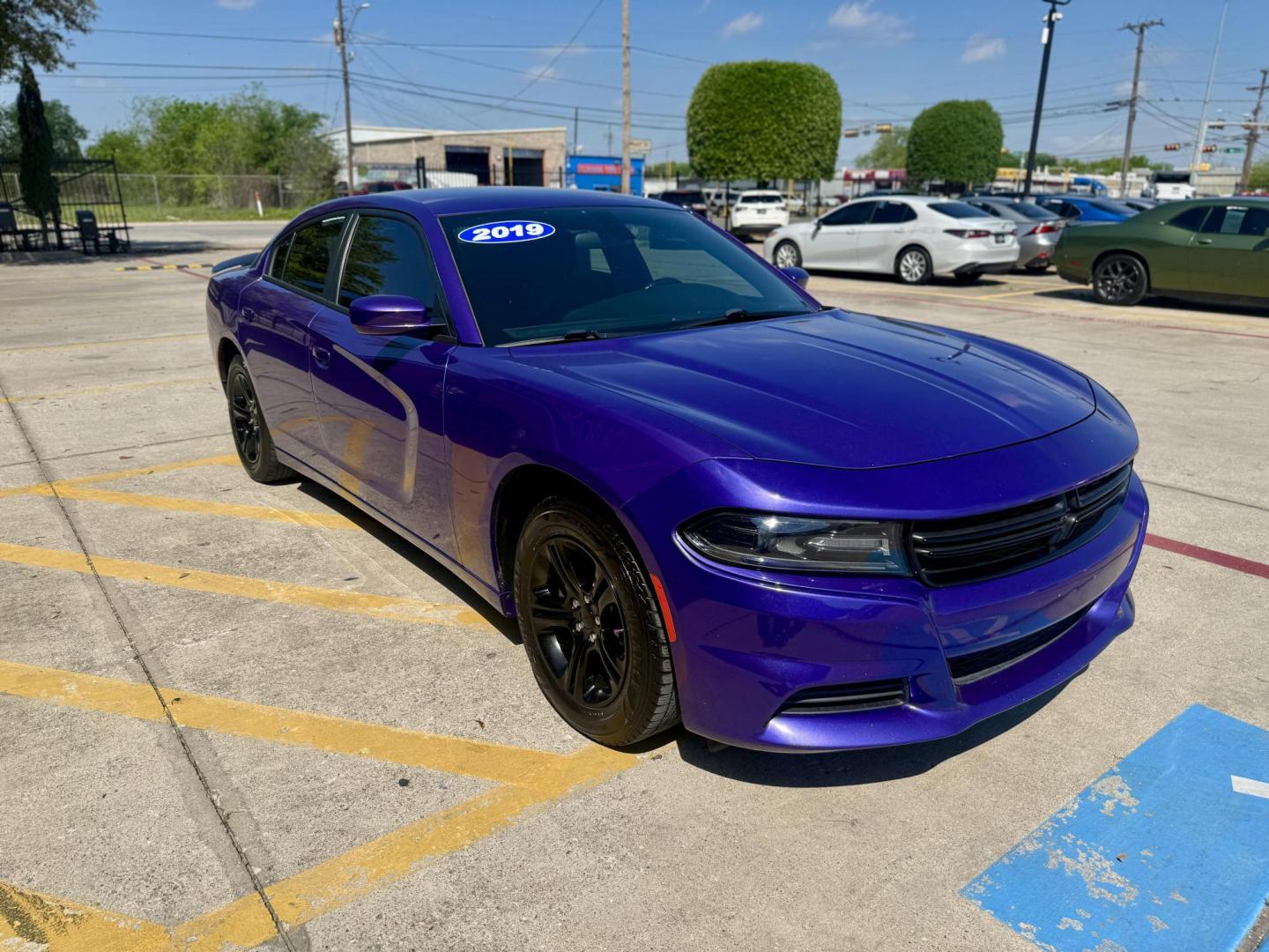2019 Plum Crazy Pearl Coat /Black, cloth Black, leather Black/Brazen Gold, lea Dodge Charger 65048 (2C3CDXBG4KH) with an 3.6L V6 DOHC 24V engine, 8-Speed Automatic transmission, located at 2401 E Main St., Grand Prairie, TX, 75050, (972) 262-4440, 32.748981, -96.969643 - Photo#6