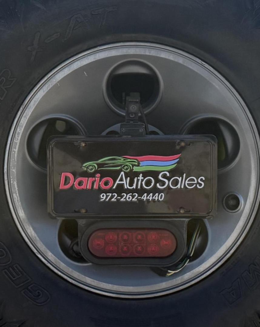 2013 Commando Green /Black Cloth Interior Black Leather Interior Black/ Jeep Wrangler 45733 (1C4BJWFG9DL) with an 3.6L V6 DOHC 24V FFV engine, 5-Speed Automatic6-Speed Manual transmission, located at 2401 E Main St., Grand Prairie, TX, 75050, (972) 262-4440, 32.748981, -96.969643 - Photo#1