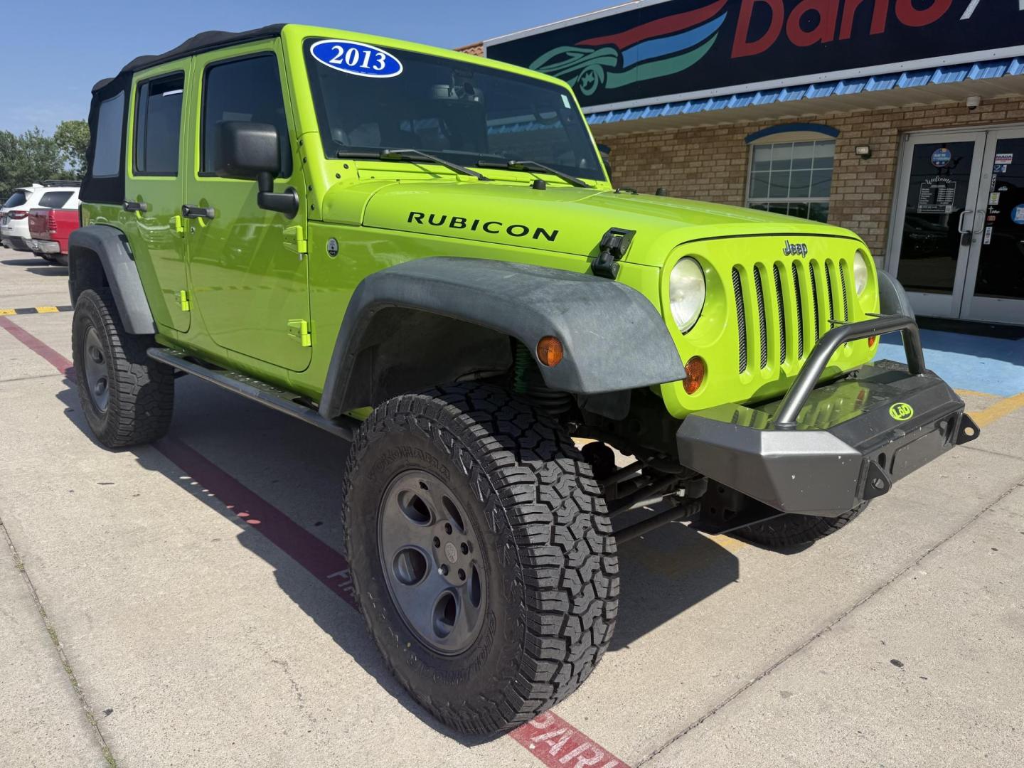 2013 Commando Green /Black Cloth Interior Black Leather Interior Black/ Jeep Wrangler 45733 (1C4BJWFG9DL) with an 3.6L V6 DOHC 24V FFV engine, 5-Speed Automatic6-Speed Manual transmission, located at 2401 E Main St., Grand Prairie, TX, 75050, (972) 262-4440, 32.748981, -96.969643 - Photo#2