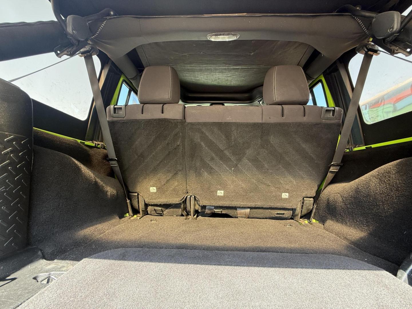 2013 Commando Green /Black Cloth Interior Black Leather Interior Black/ Jeep Wrangler 45733 (1C4BJWFG9DL) with an 3.6L V6 DOHC 24V FFV engine, 5-Speed Automatic6-Speed Manual transmission, located at 2401 E Main St., Grand Prairie, TX, 75050, (972) 262-4440, 32.748981, -96.969643 - Photo#4